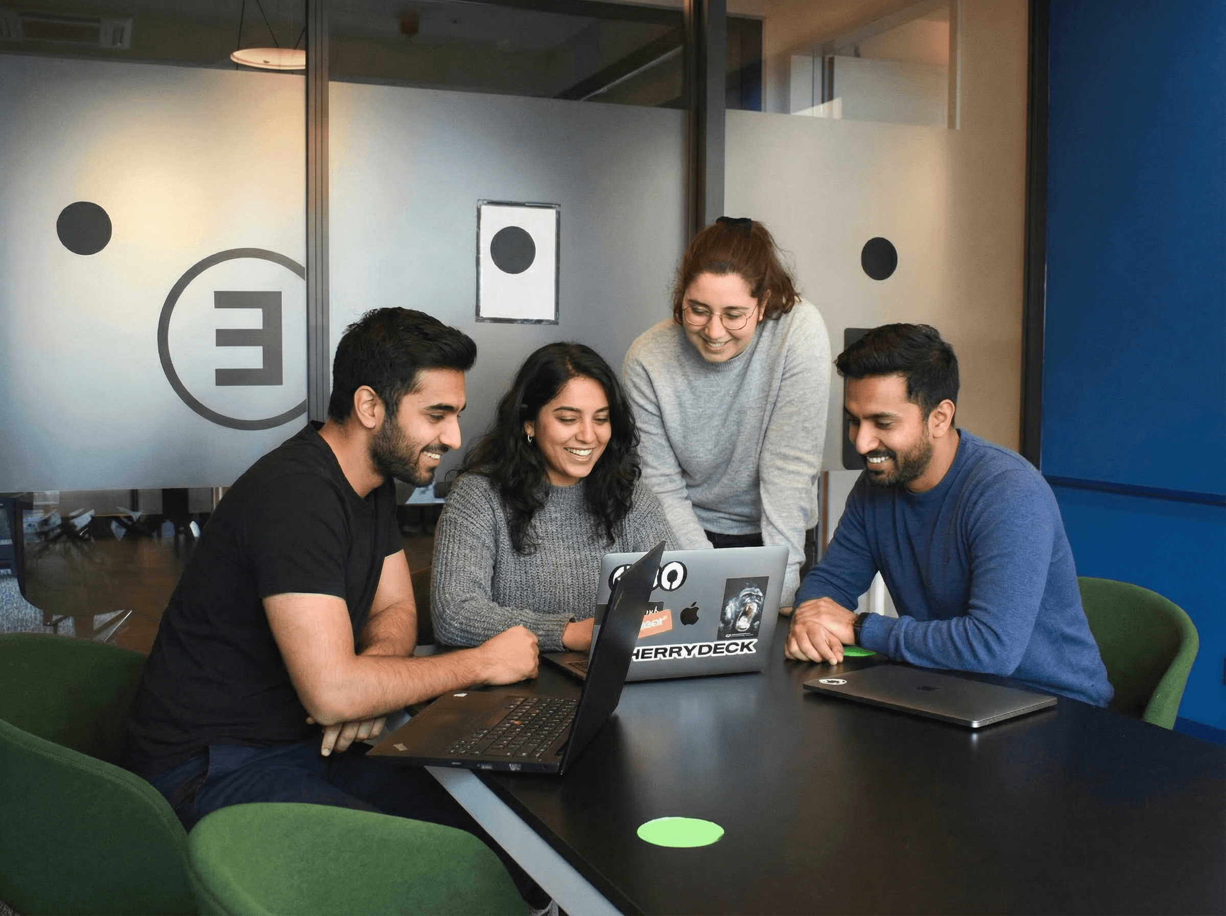 people sitting on chair in front of laptop computers