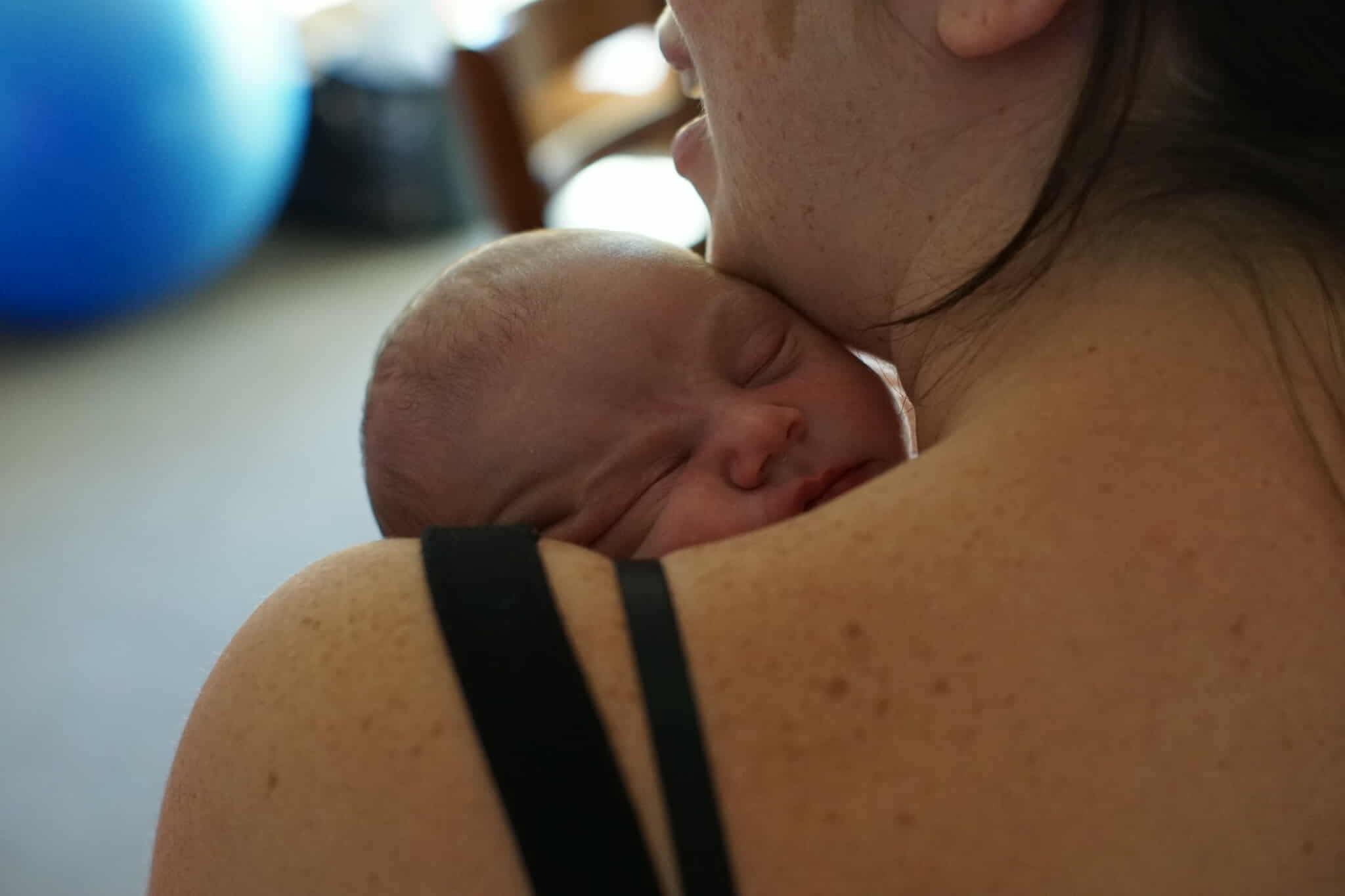 person holding baby's index finger