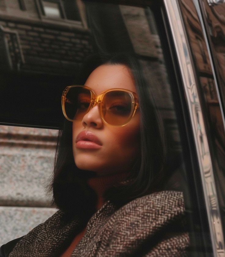 woman in wedding dress while holding flower during daytime