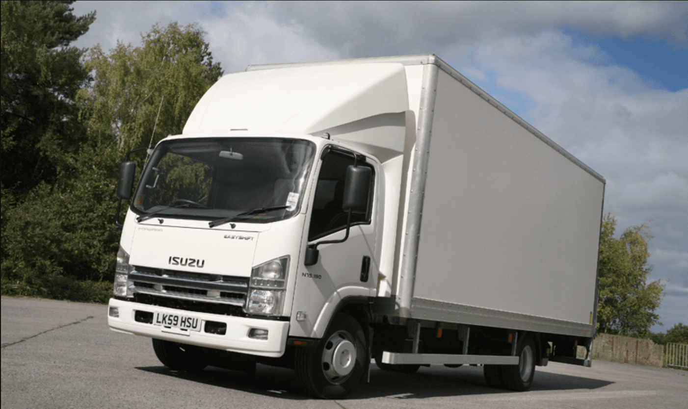 image of a 7.7 Tonne truck driving along a warehouse loading yard