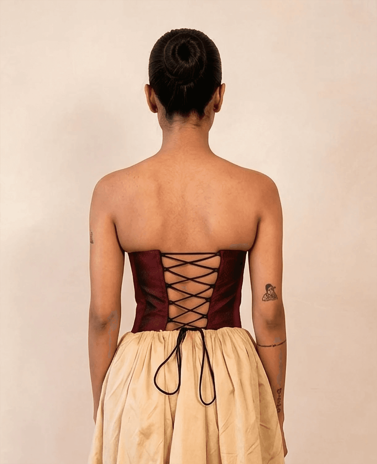 four-panel corset crafted from a vintage Maroon silk sari, featuring V-cut detailing and adjustable lace-up panels, consciously handcrafted by Bodements to celebrate heritage, craft, and mindful fashion.