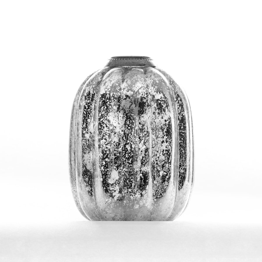 Textured glass vessel with metallic sheen