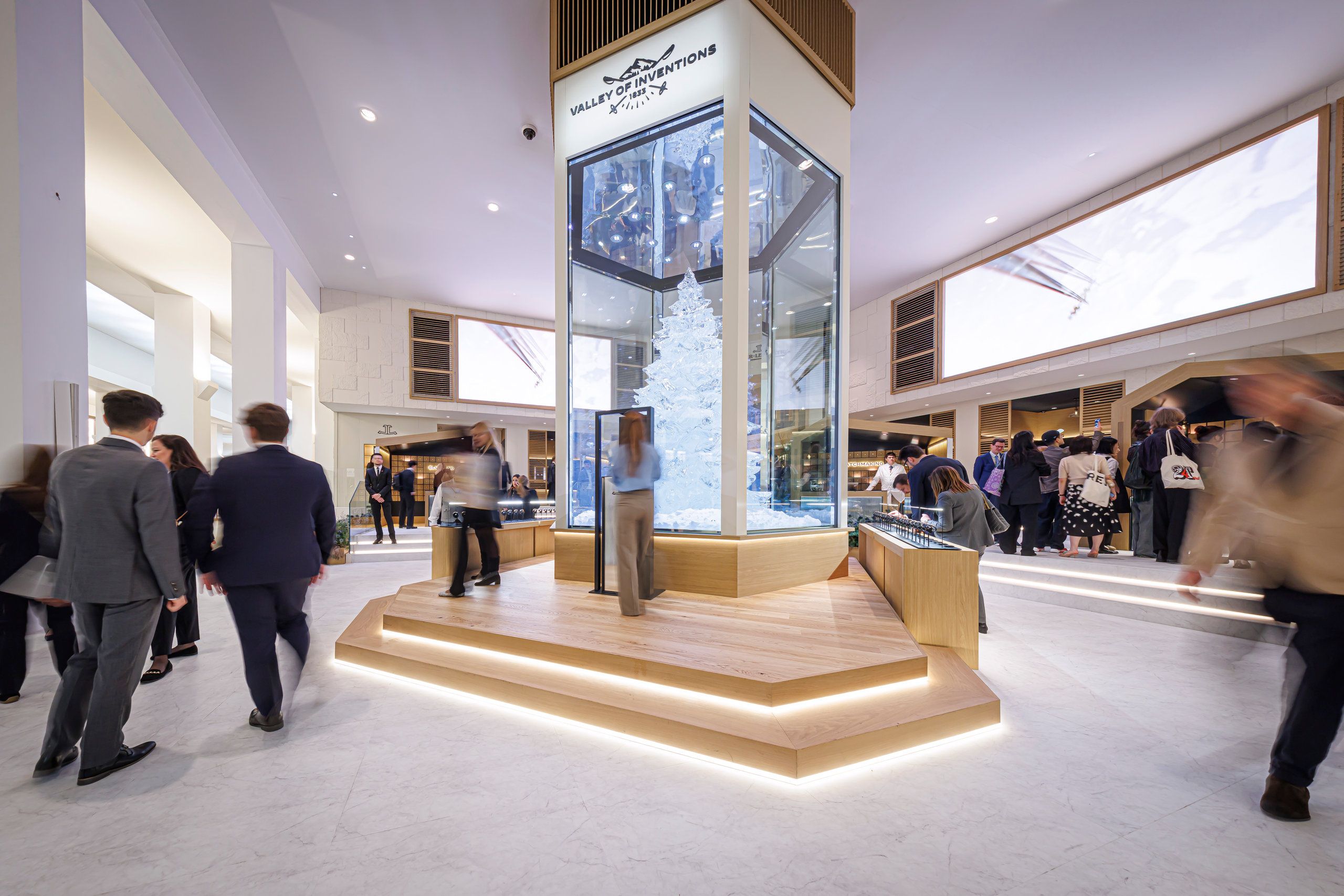 Jaeger LeCoultre booth with glass installation and winter themed Valley of Inventions display at Watches And Wonders