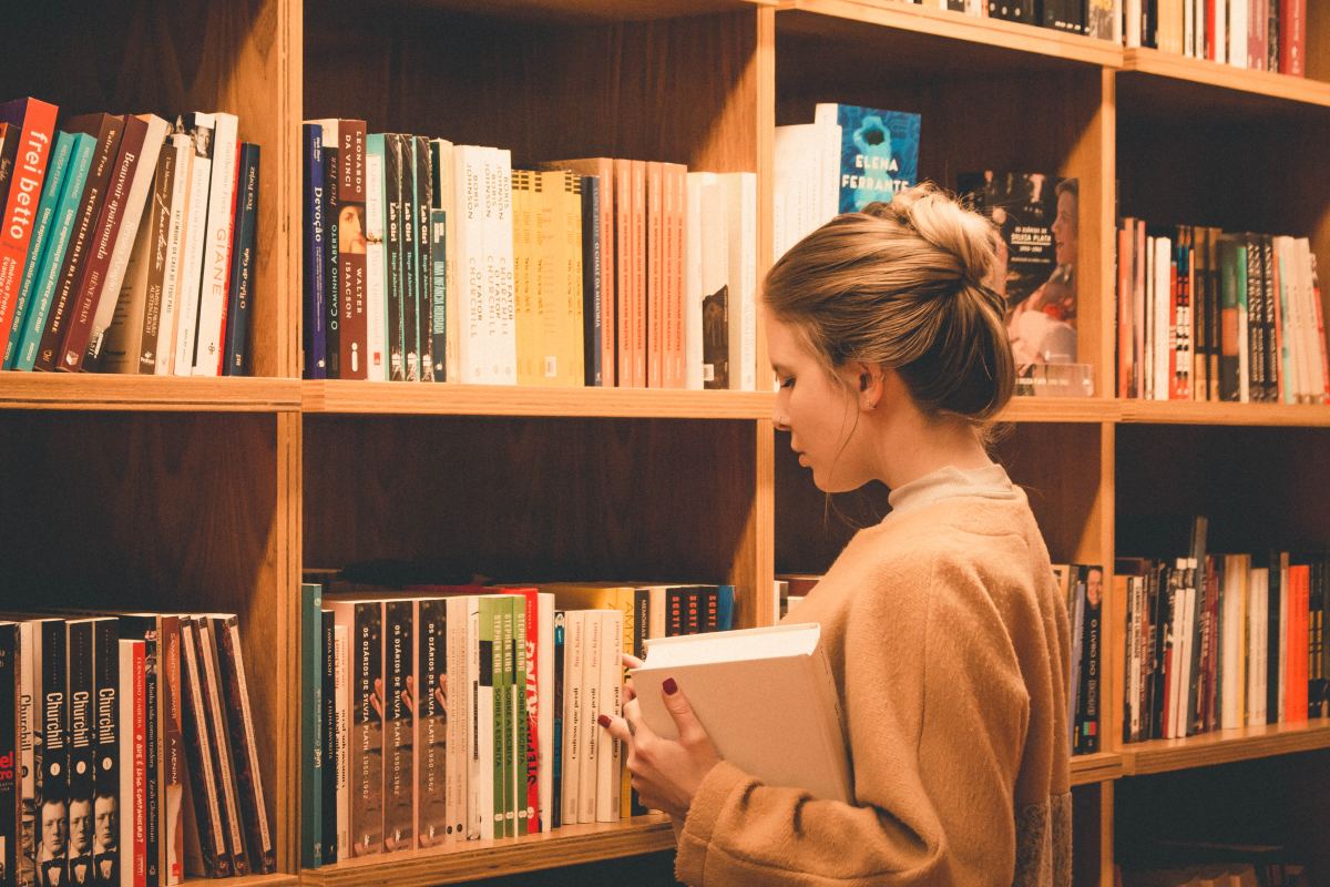 woman in library - How to Read Books Faster