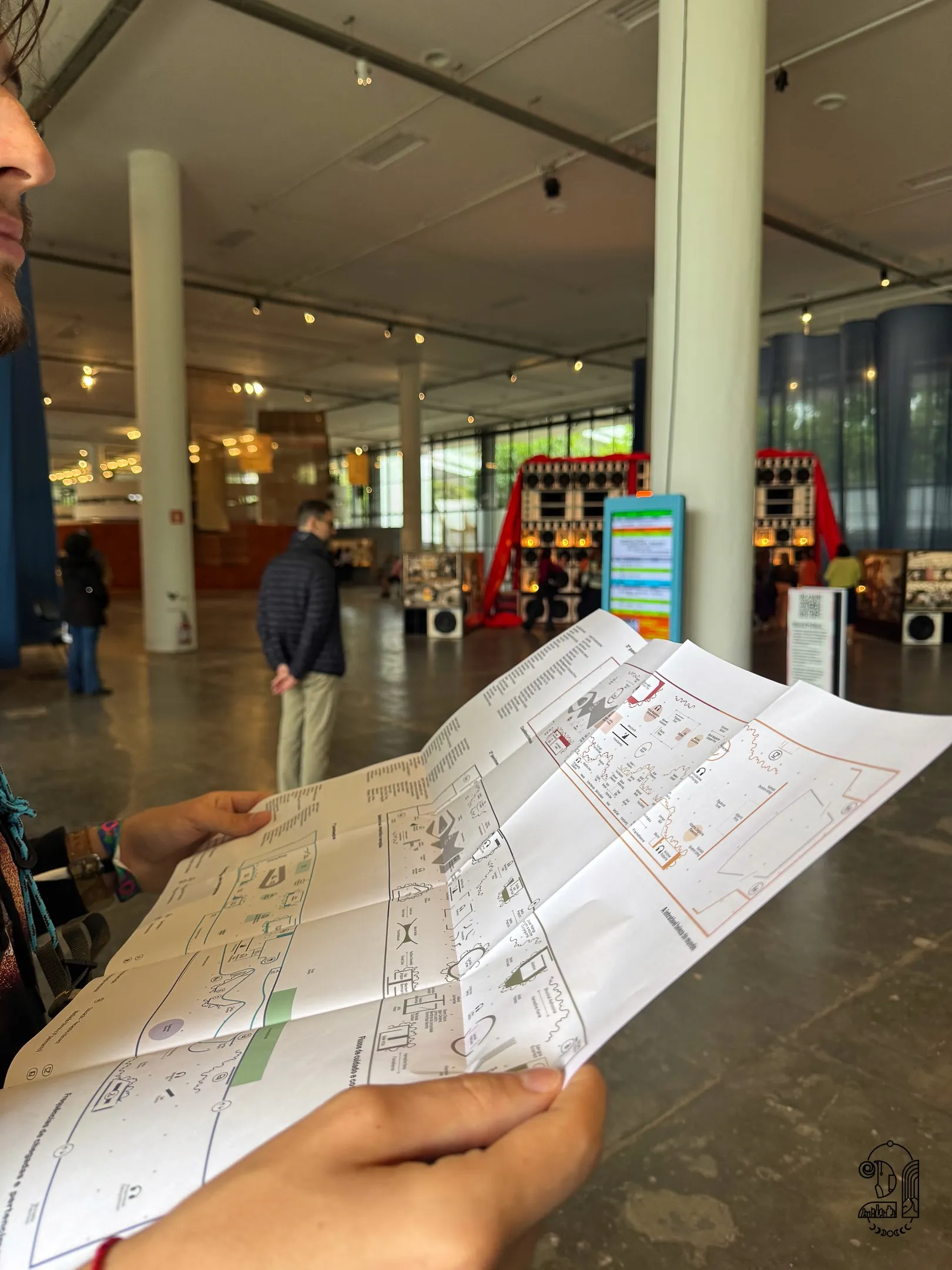 A person holding a map in an art foundation