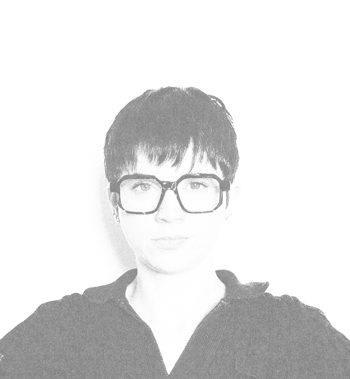 A smiling woman writing on a piece of paper in her home