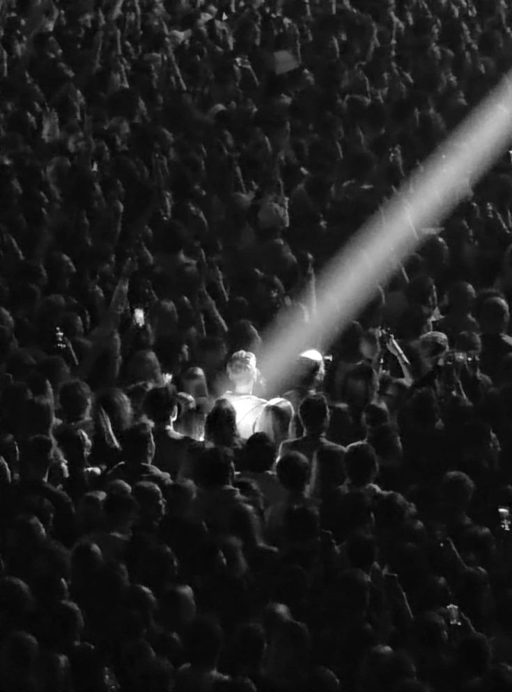 A black-and-white portrait of an elderly woman