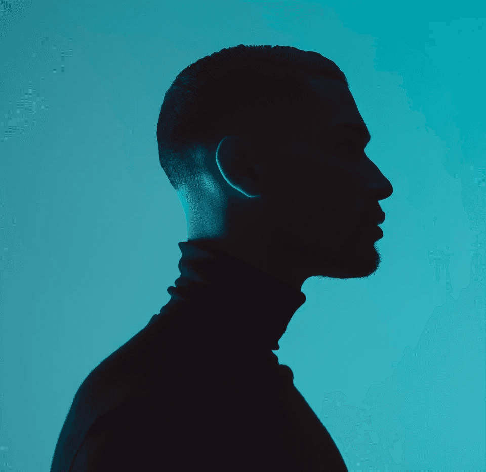 man in white hoodie wearing black round analog watch