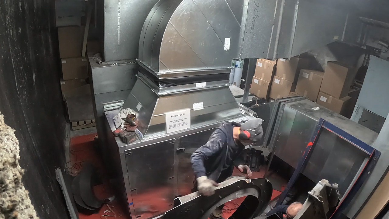 New return fan unit installed as old fan scroll is removed on-site.