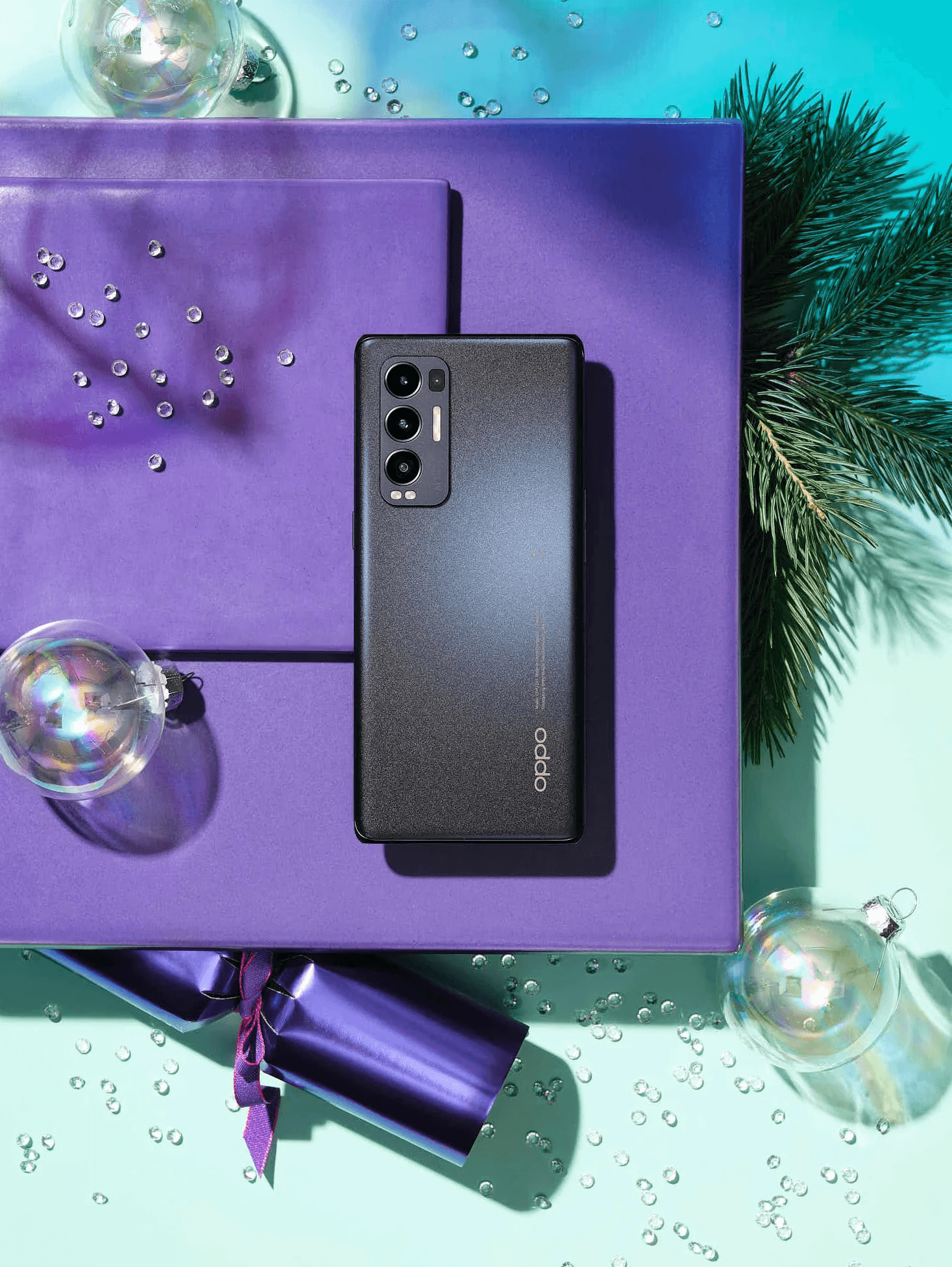 Black smartphone on purple holiday-themed background with ornaments.