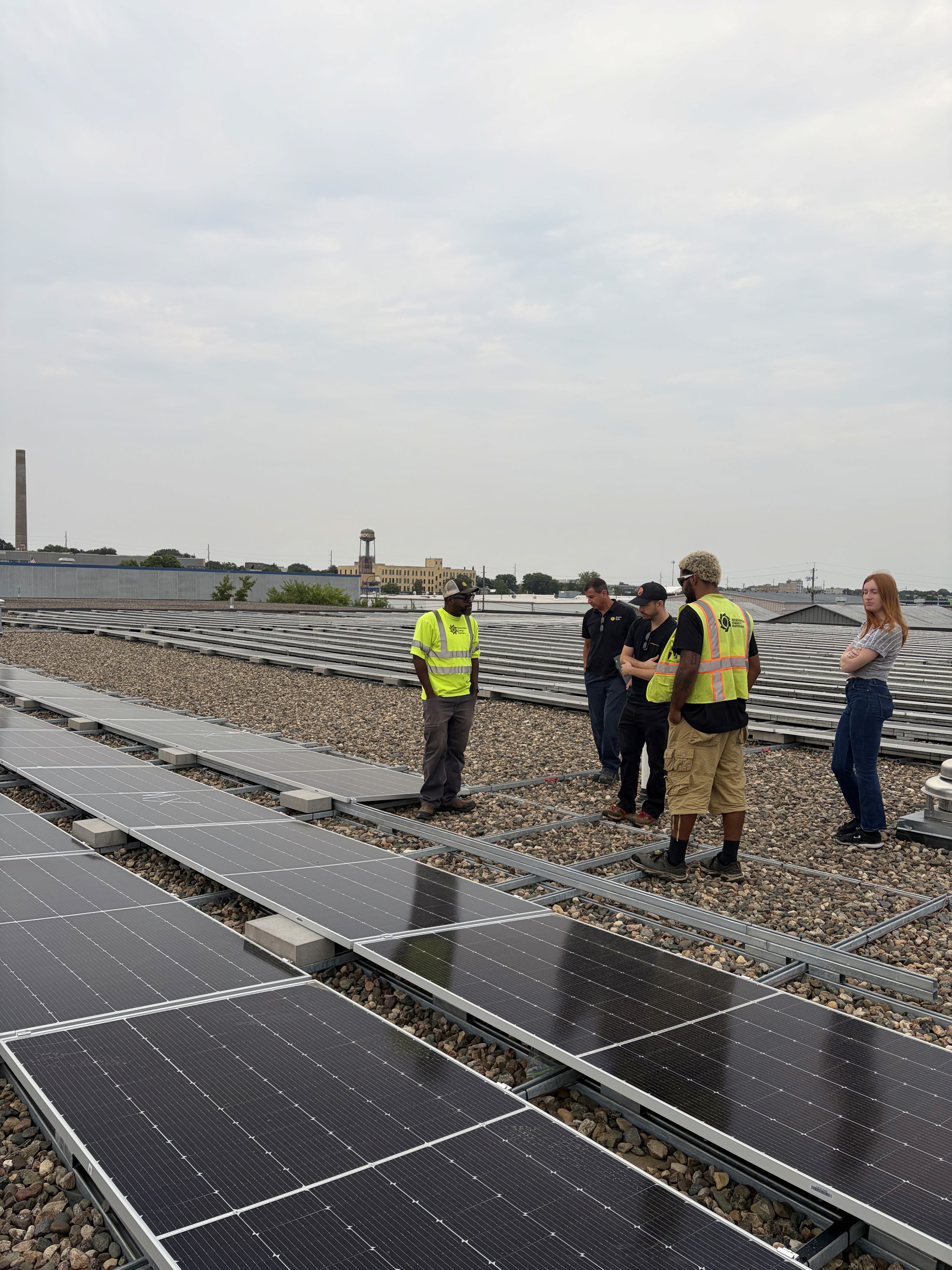 Worker installing solar panels
