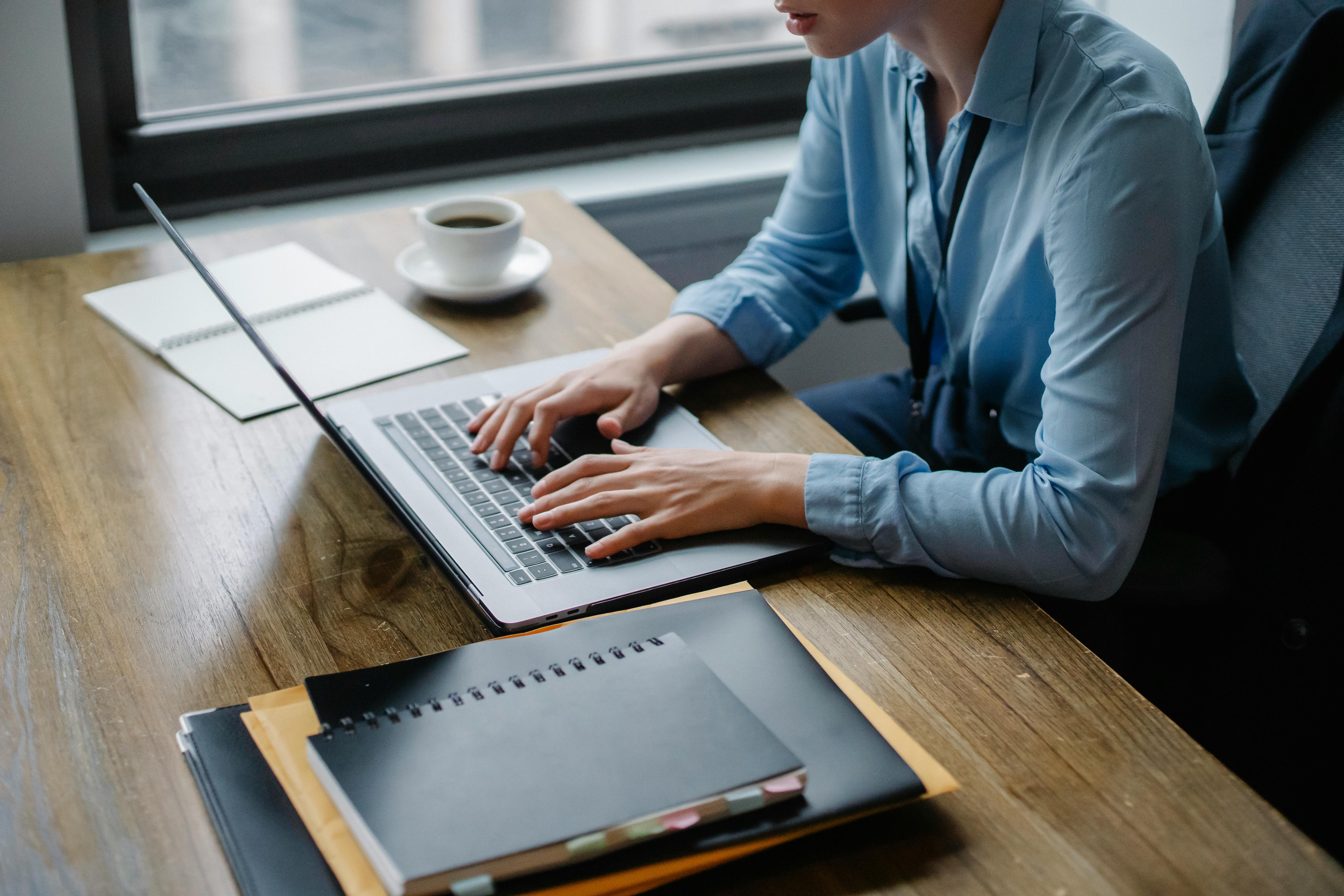 Man studying how to avoid email spam using laptop