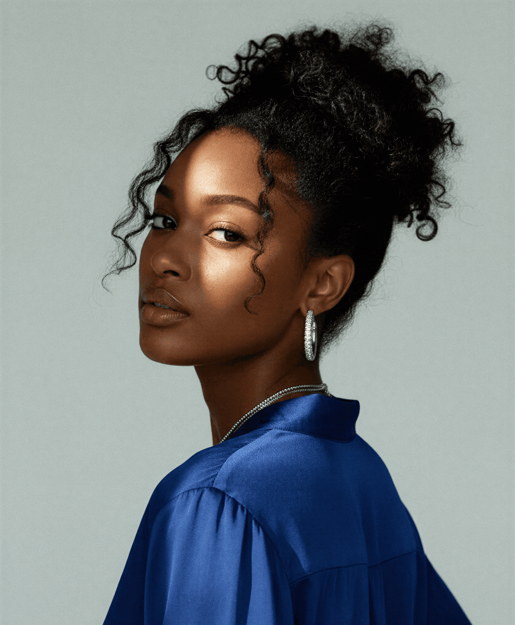 a blurry photo of a person standing in front of a wall