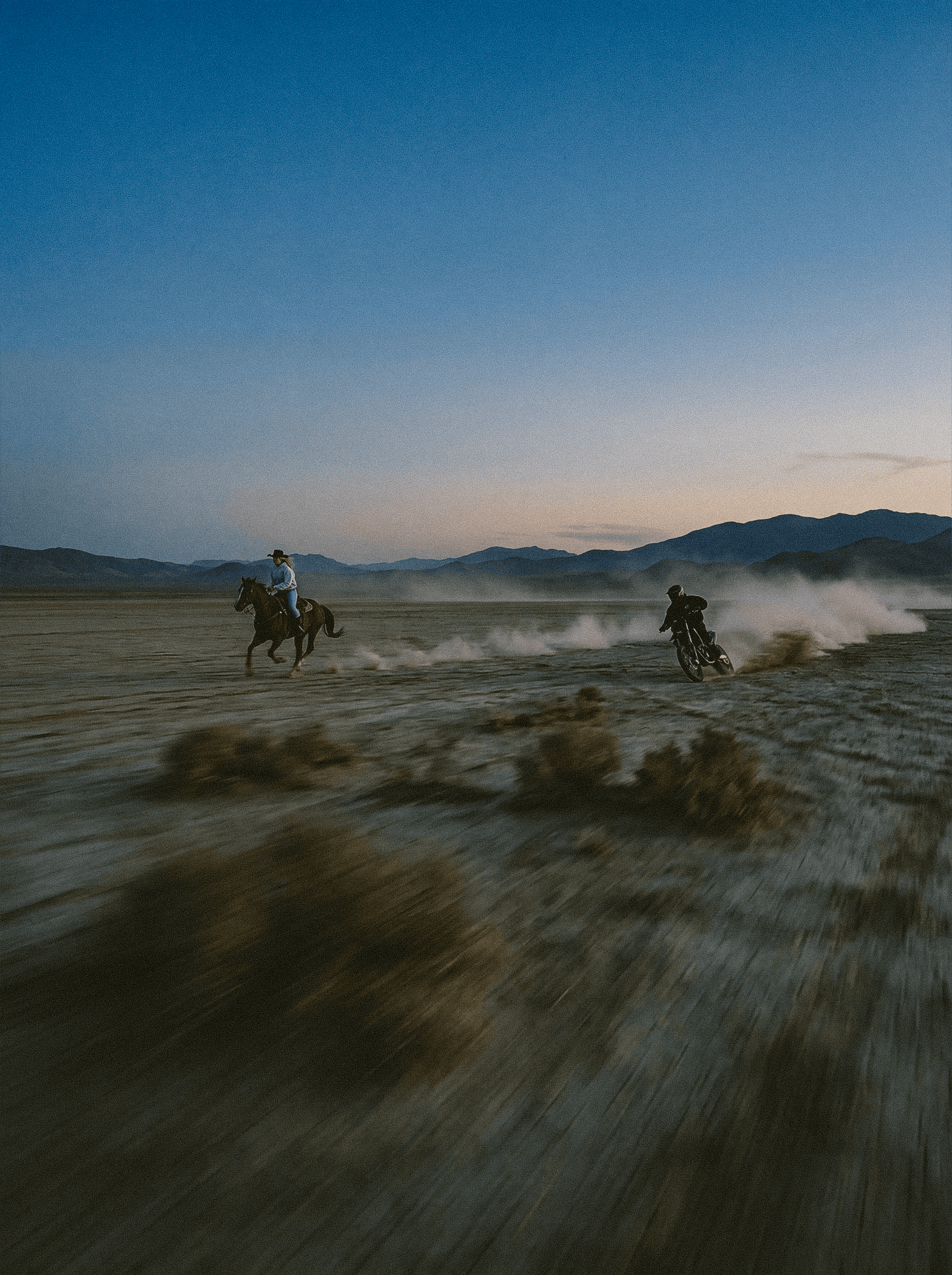 A dynamic photo of a man on a dirtbike with a graphic tee on