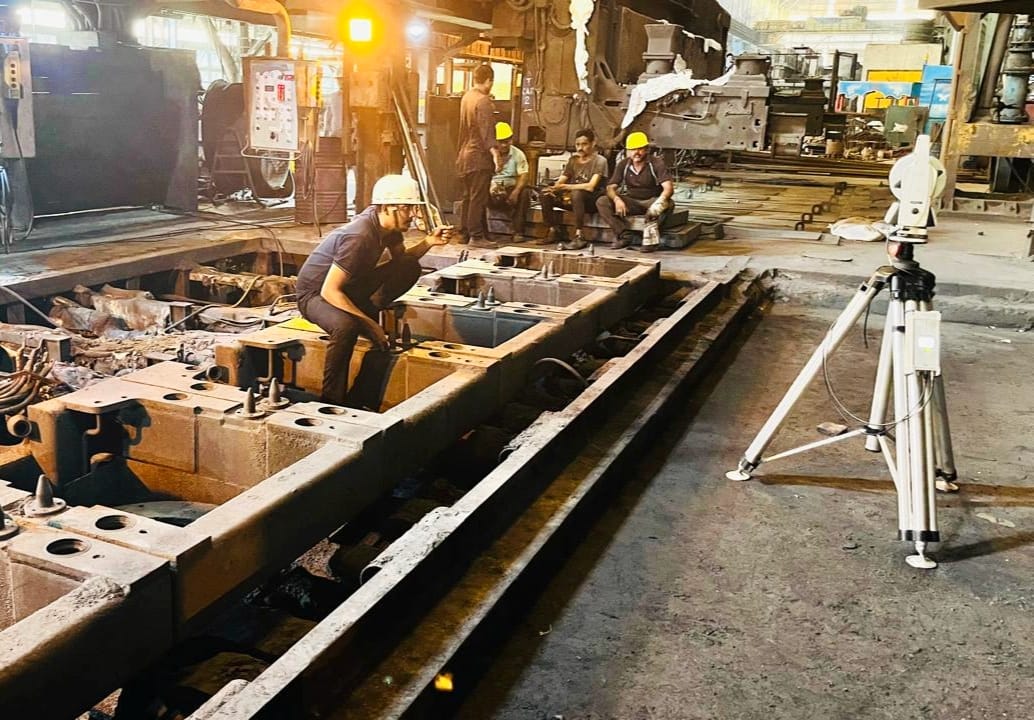 A close up of pipes and pipes in front of a tree