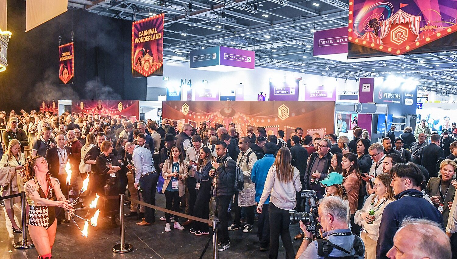 A large truck with a crane parked under clear blue skies and surrounded by palm trees.