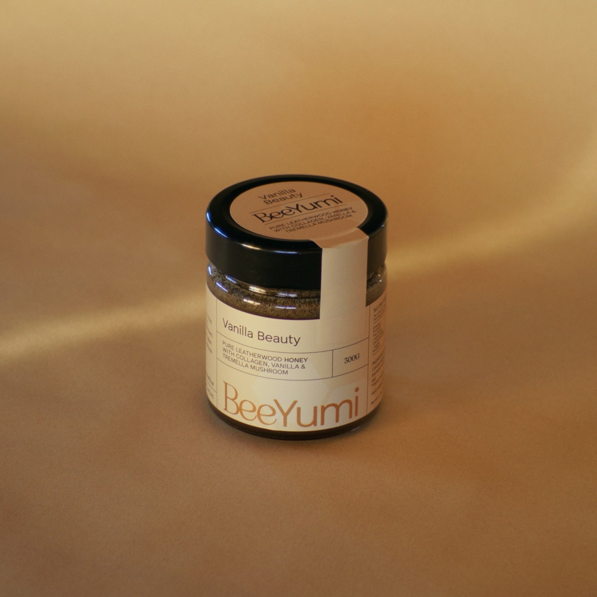 Jar of 'Vanilla Beauty' by BeeYumi on a beige background