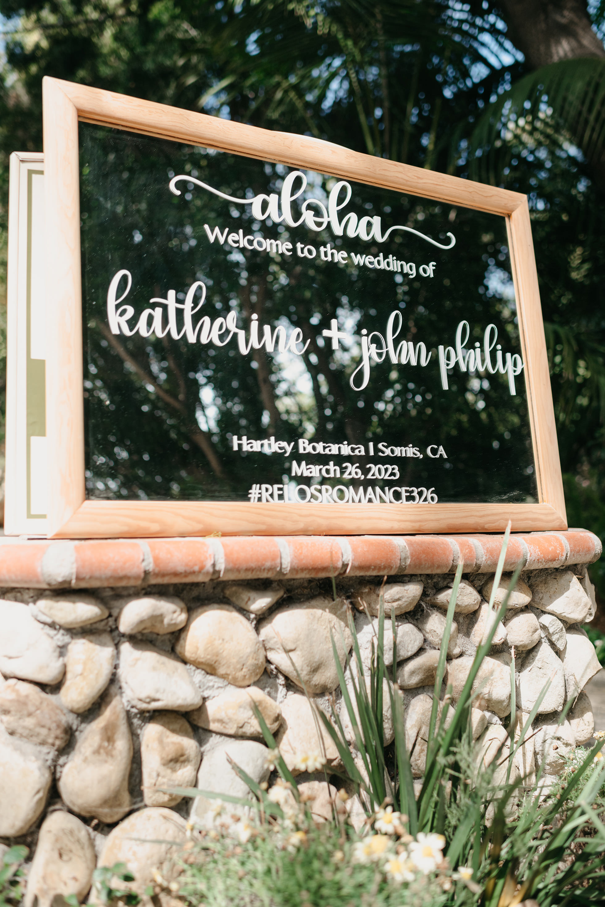 Flat lay wedding details with bouquet, rings, and sparkling bridal heels