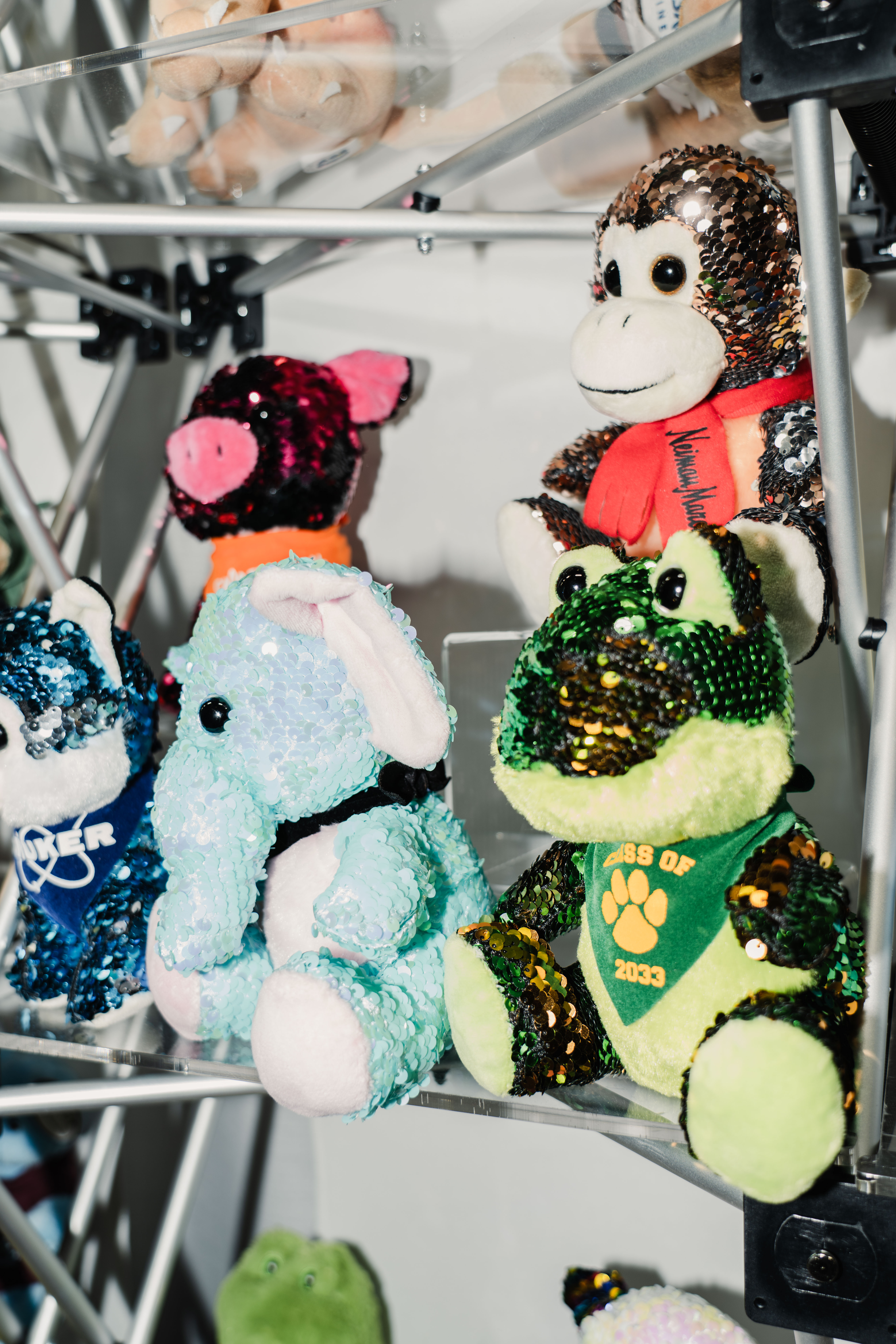 Sequined plush pig, elephant, frog, and monkey.