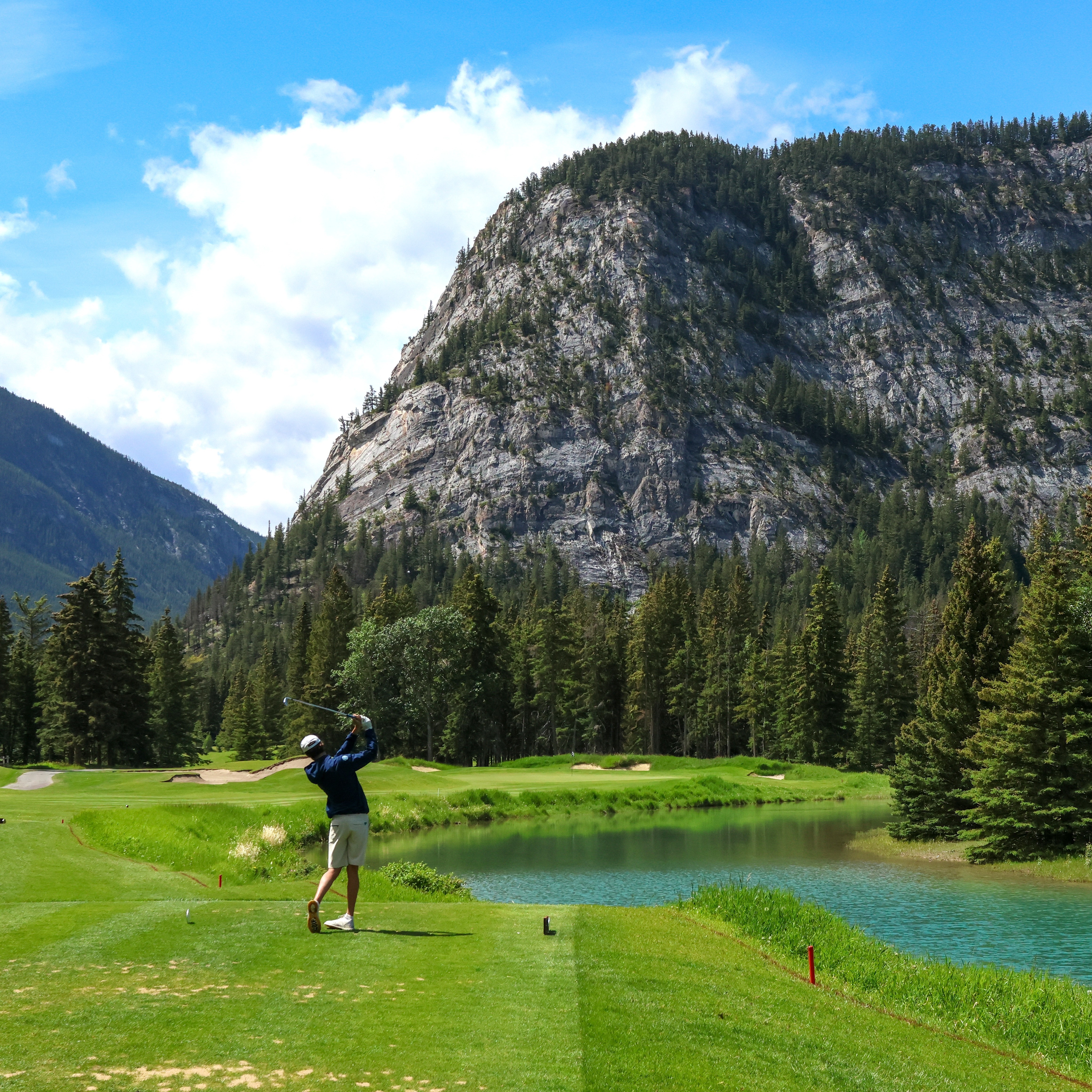 Group of men standing with Sufboard