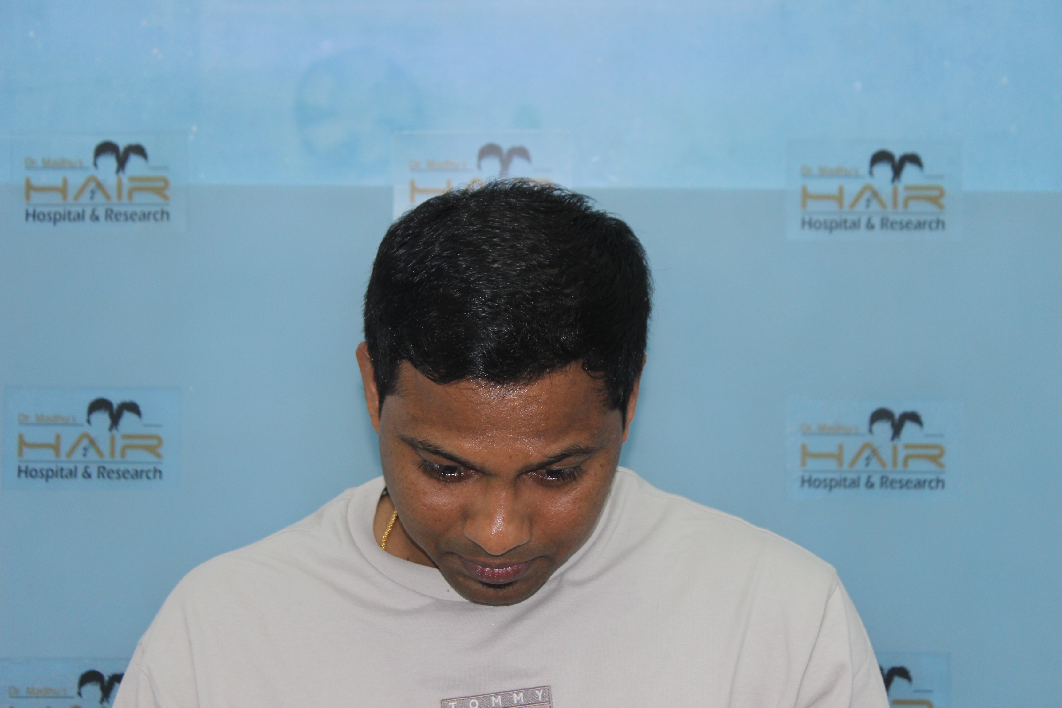 woman smiling wearing white top