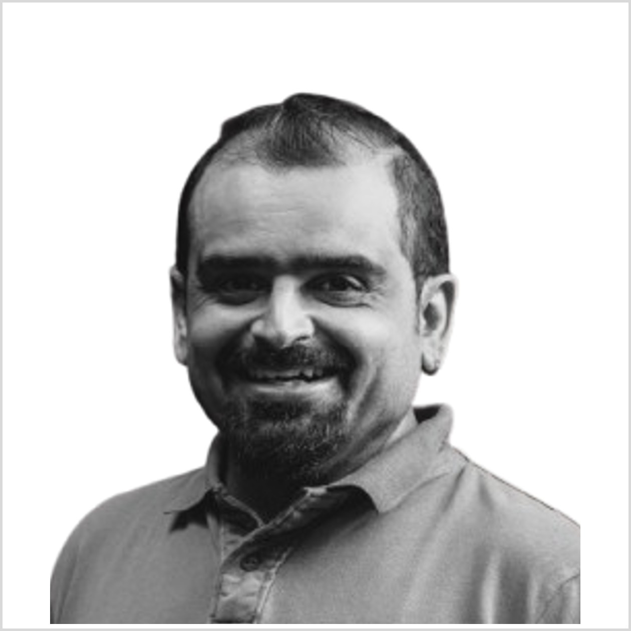 woman in black crew neck t-shirt wearing brown framed eyeglasses standing on rocky shore during