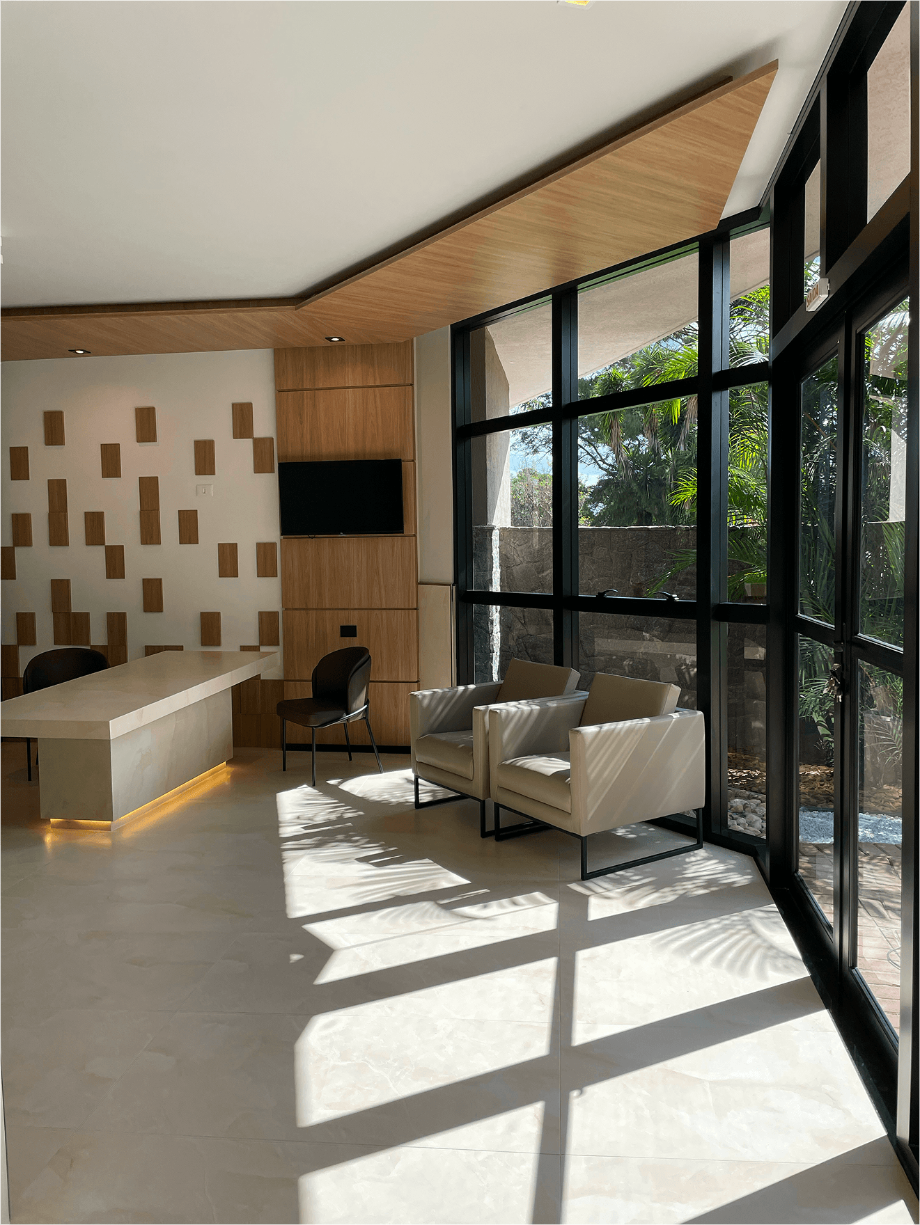 man in white shirt carrying girl in gray shirt