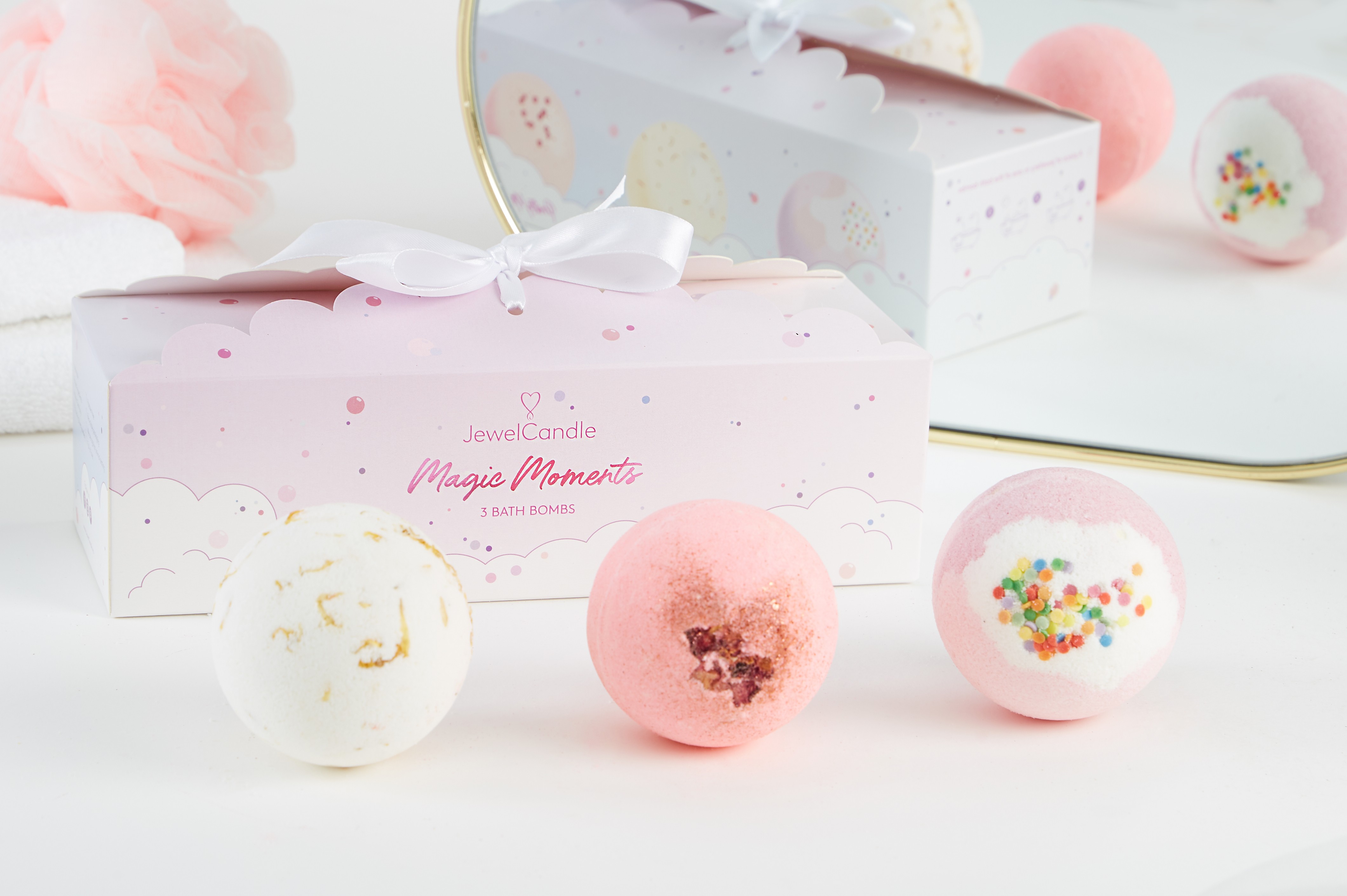 A pink, bubbly bath bomb packaging