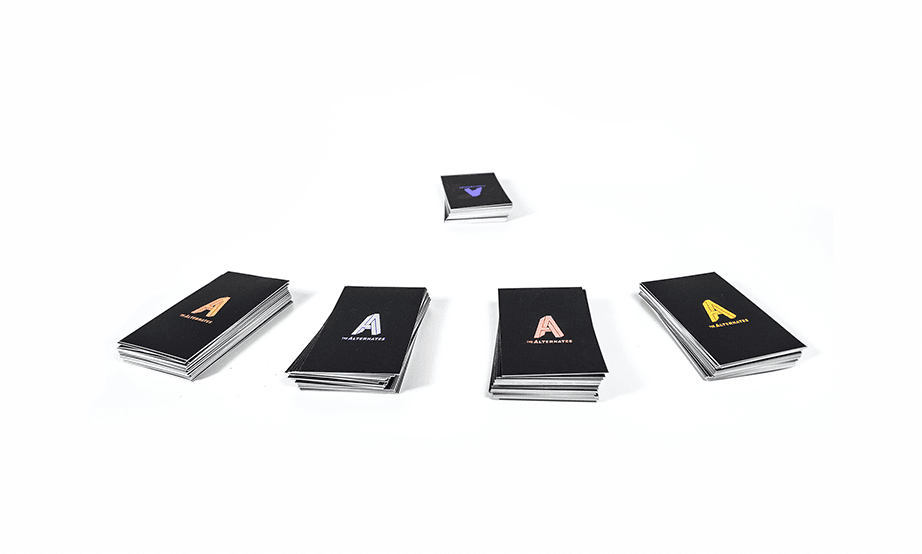 Five black books are arranged on a white background. Each book has a gold “A” logo on the cover and a white spine. The books are positioned in two rows of two, with the top row slightly offset from the bottom row. A small black book with a purple “A” logo is centered above the books. All books are identical in size and design.
