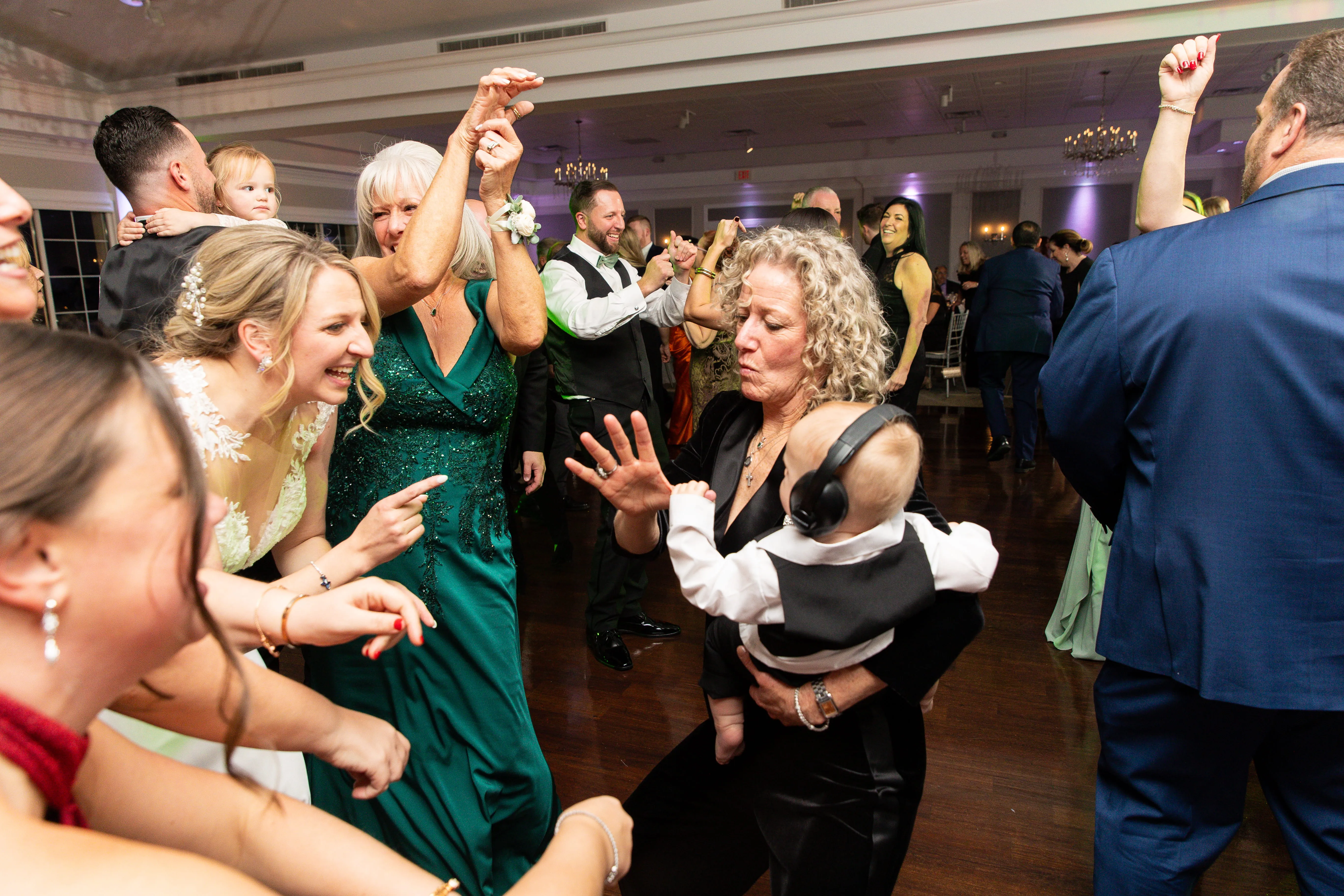 Bride dancing with guests during wedding reception in NYC