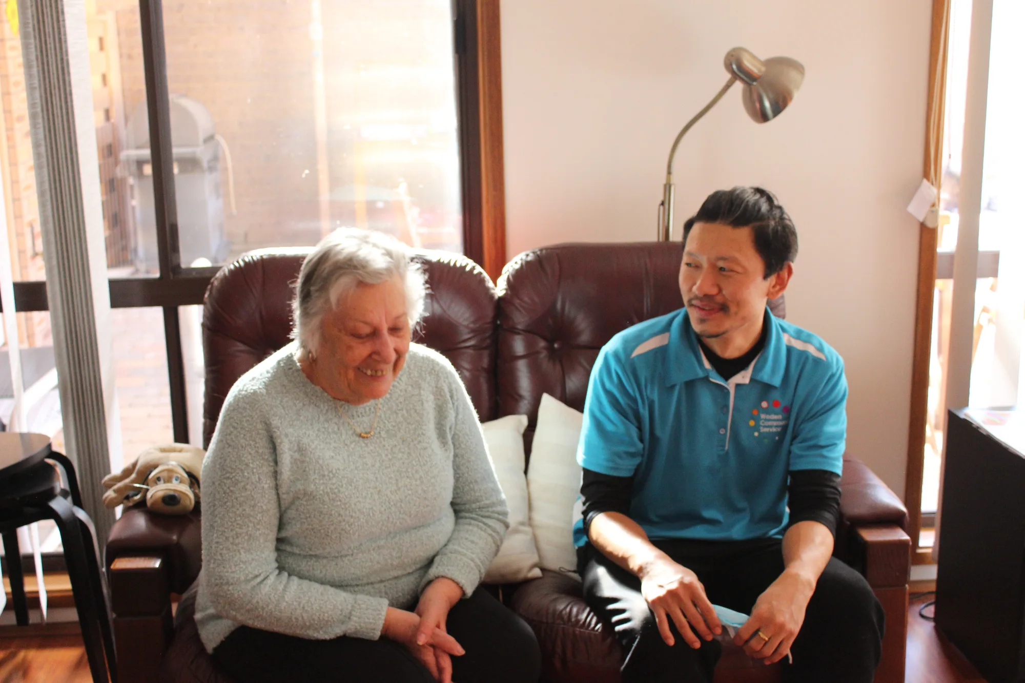 Support worker and client talking to each other