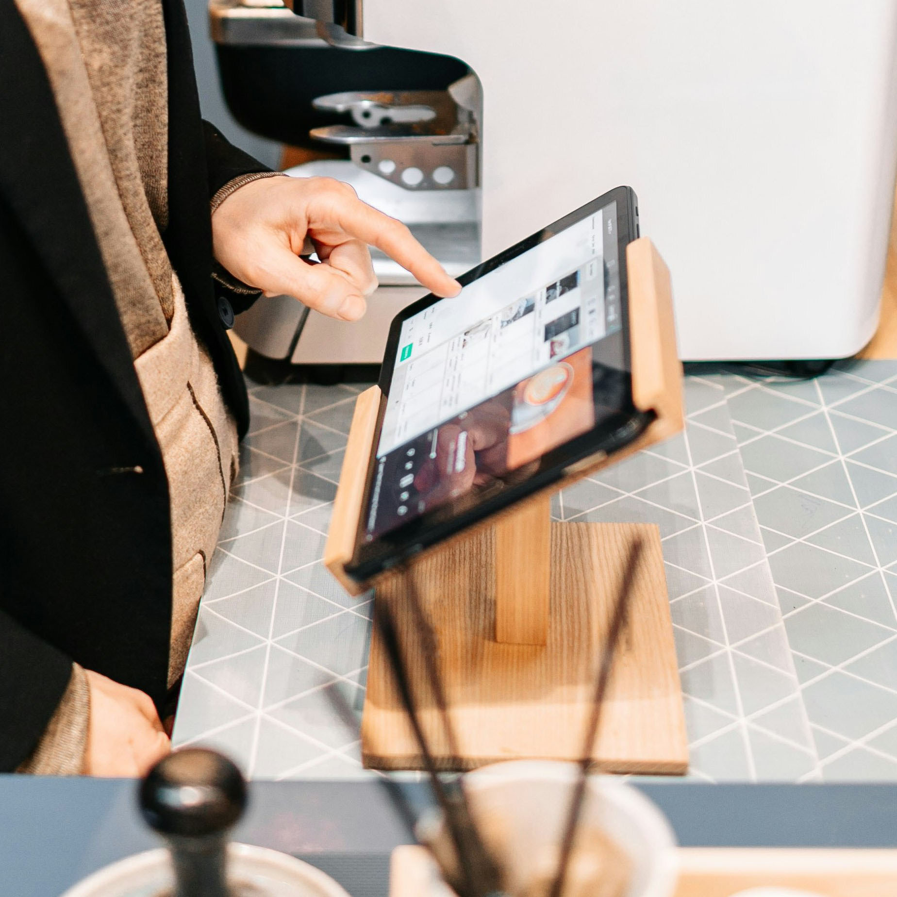 Cafe Staff Member using Pretzel POS.