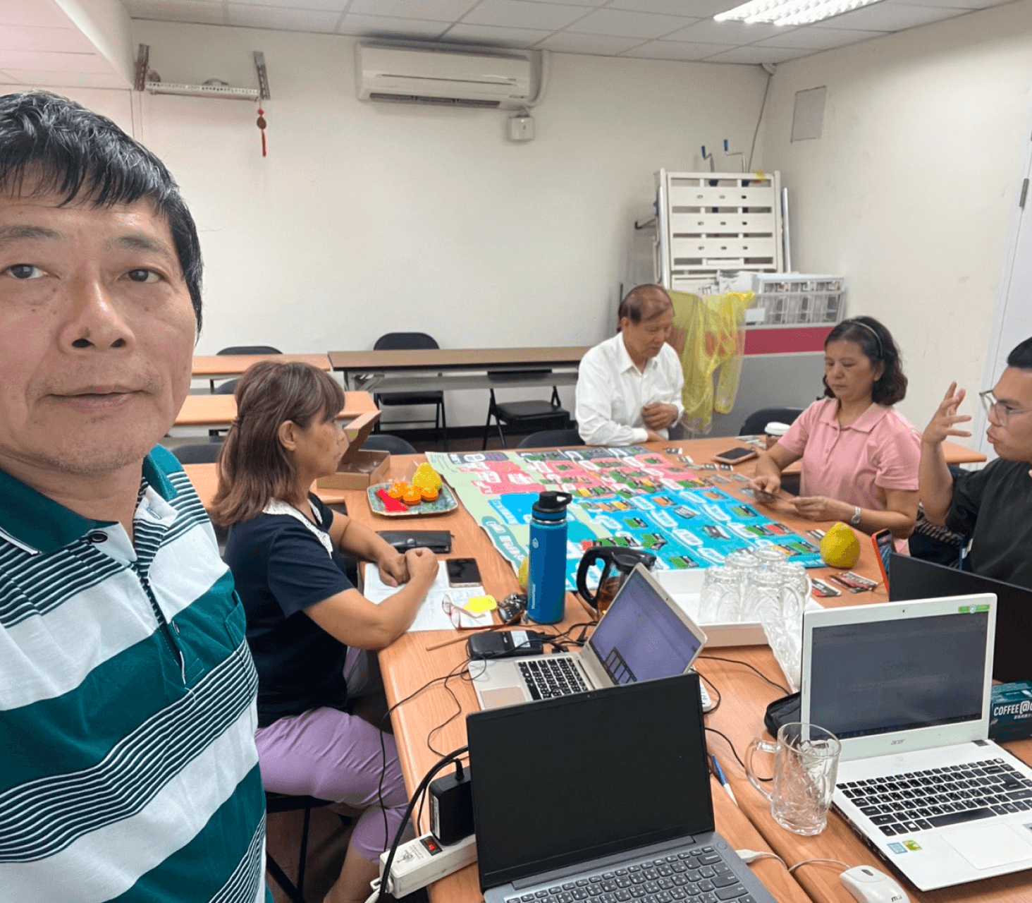 A man stading with Surfboard