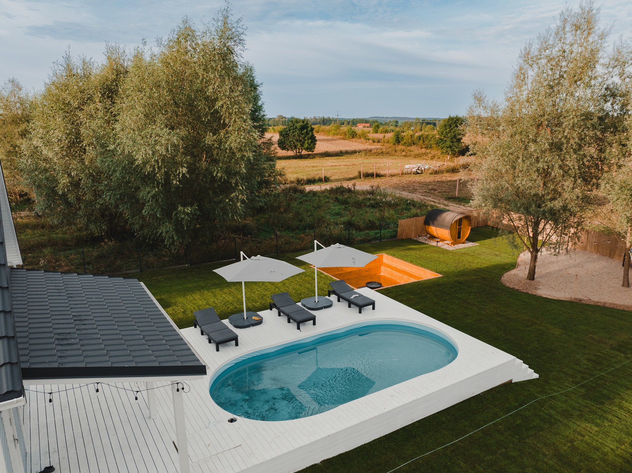 The wedding backdrop is the open sea, shimmering under late afternoon light
