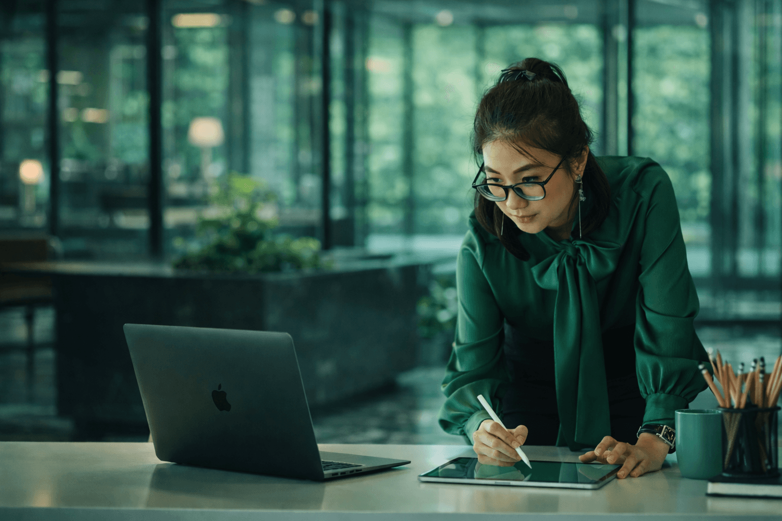 Executive assistant managing travel and bookings at a modern office desk