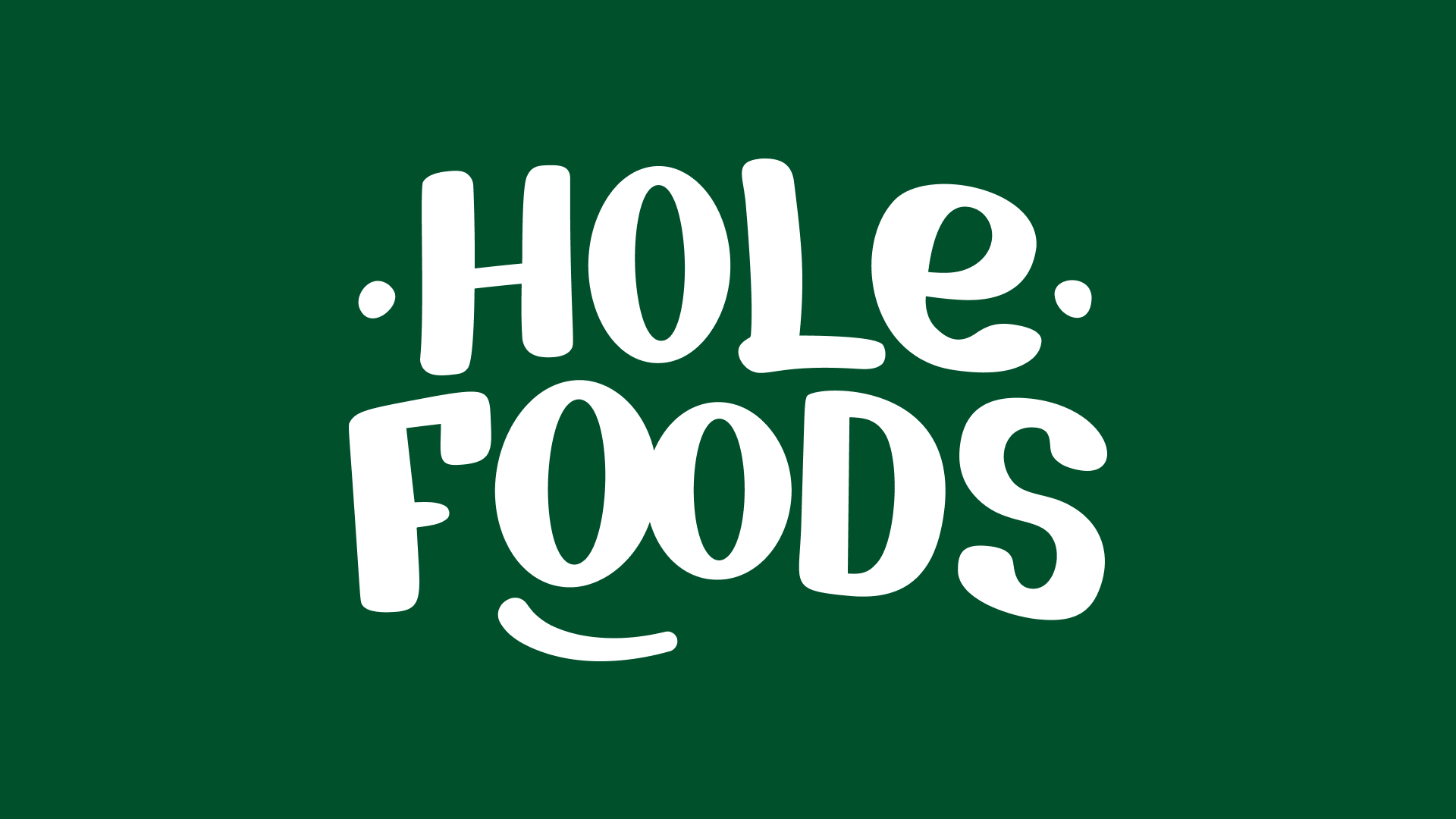 Hole Foods wordmark logo in white on a dark green background.