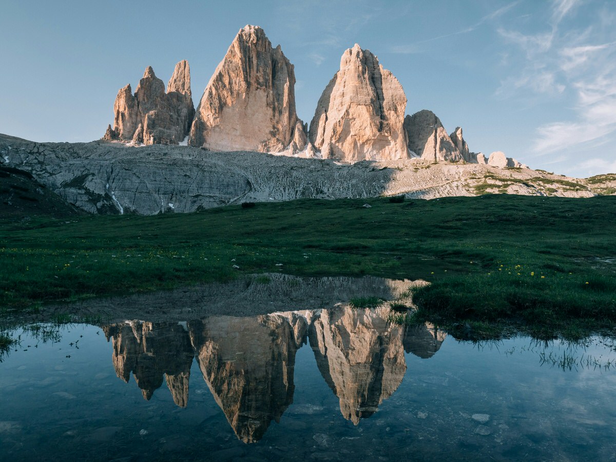tre cime formation with reflection in water