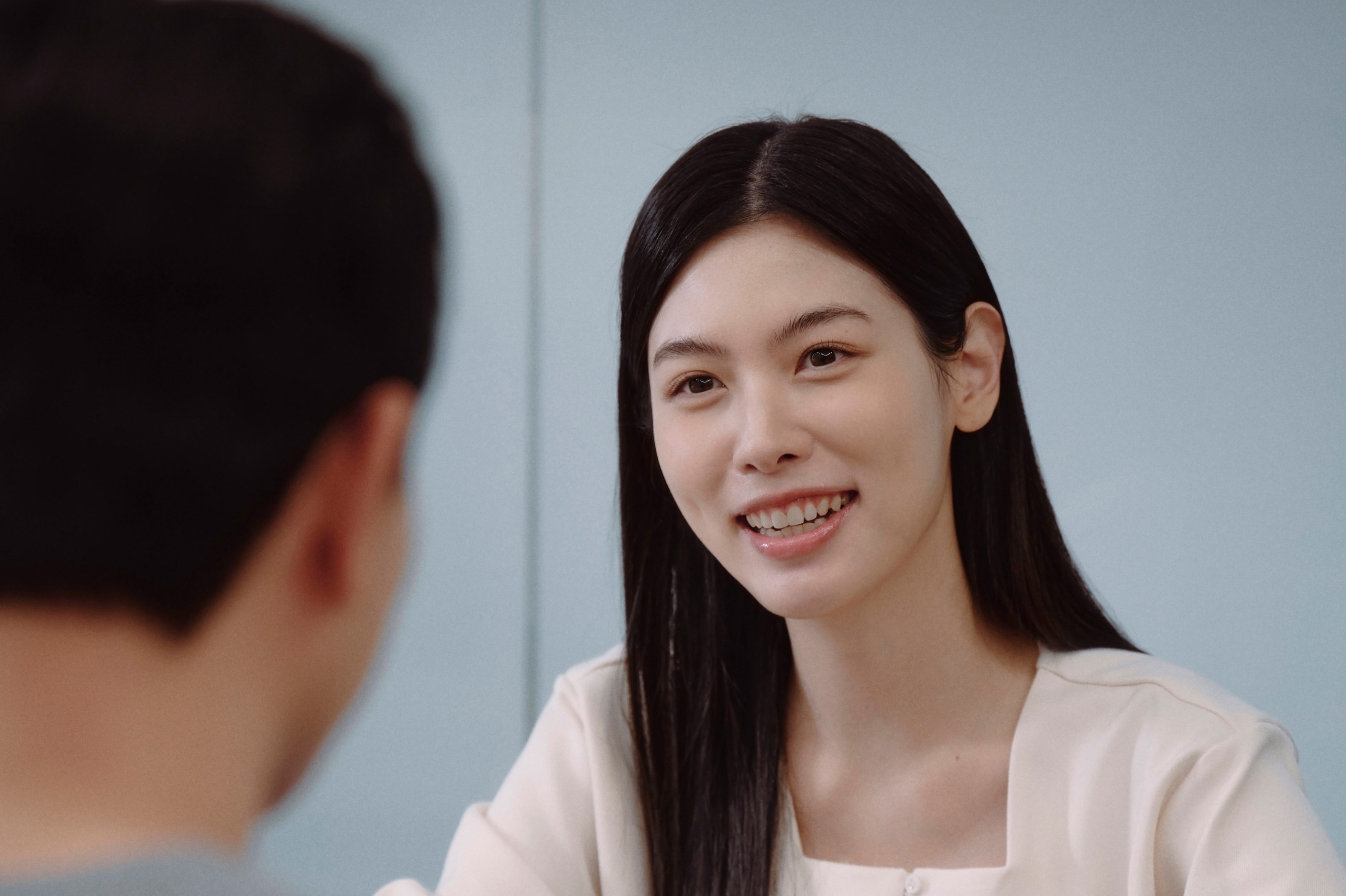 Two students smiling during a language learning session at 612 Academy, reflecting an engaging and human-centered learning experience.