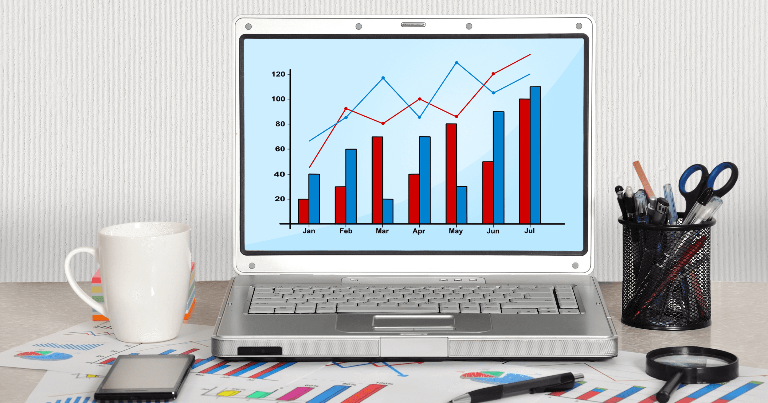 Sales charts on a laptop