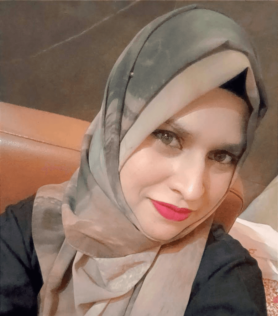 Close-up of evergreen foliage, showcasing vibrant green needles densely packed together.