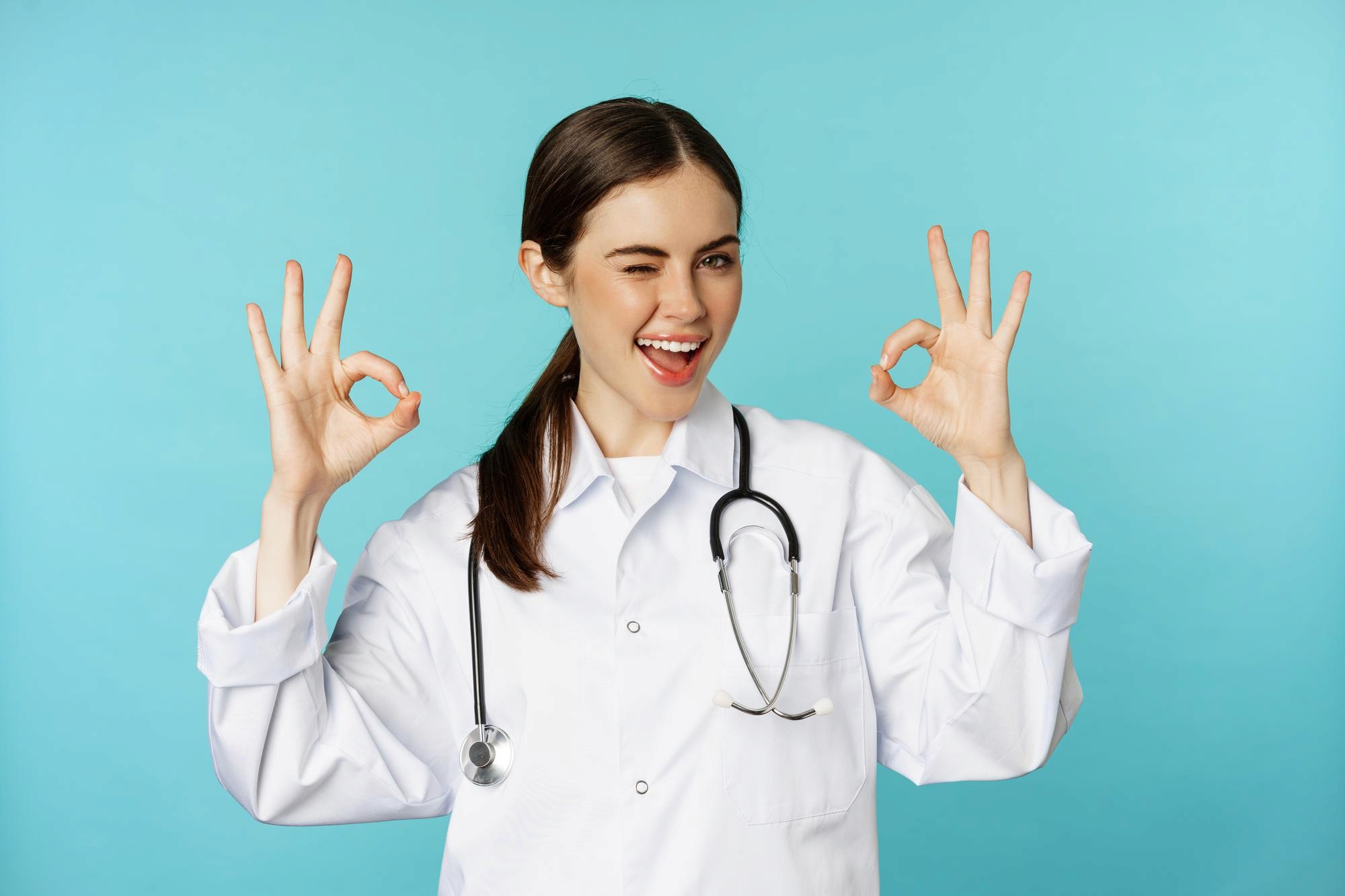 Golden retriever dog is being petted by a person. The dog is lying down, enjoying the human interaction.