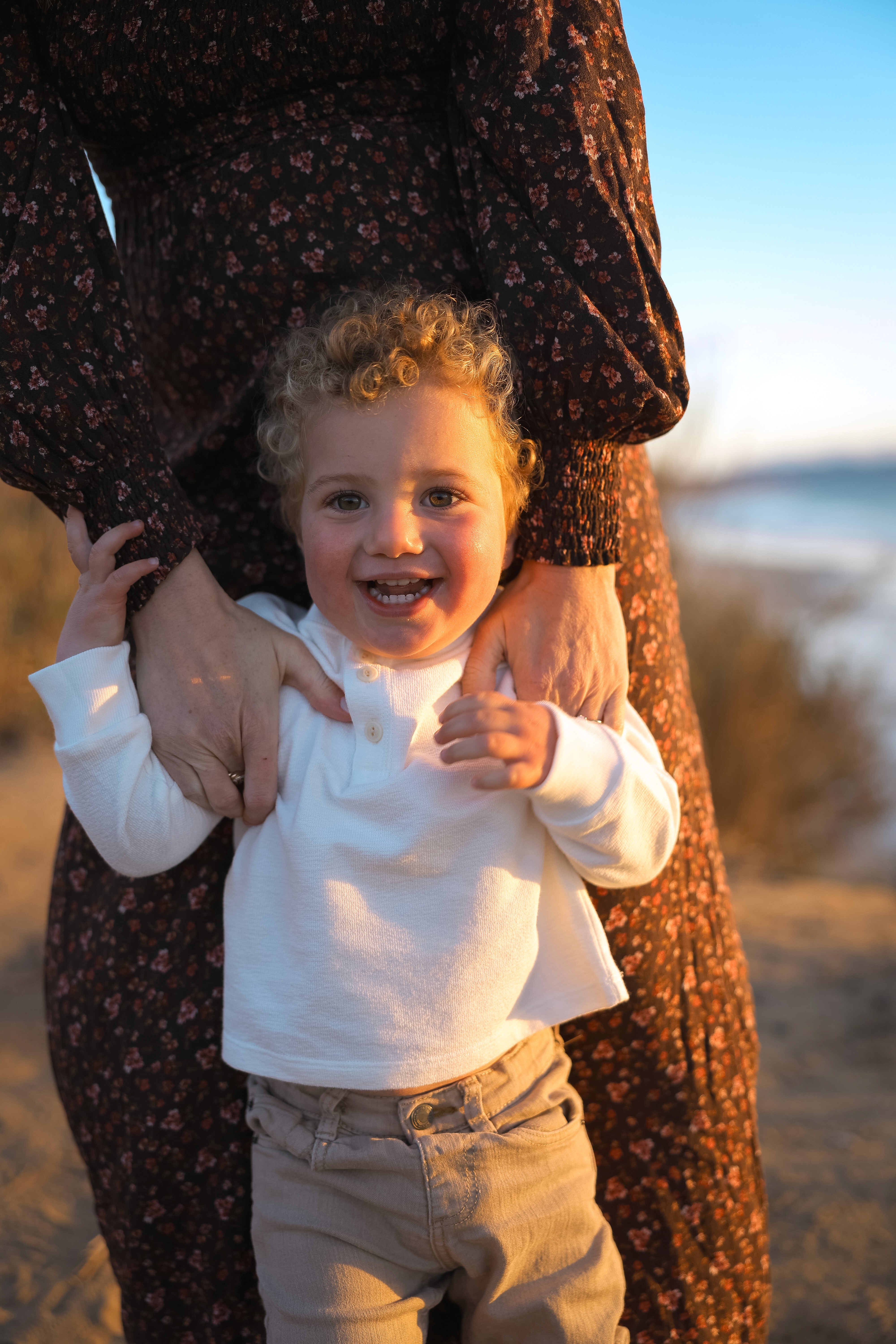 Family walking at sunset during a lifestyle photo session in Carlsbad.
