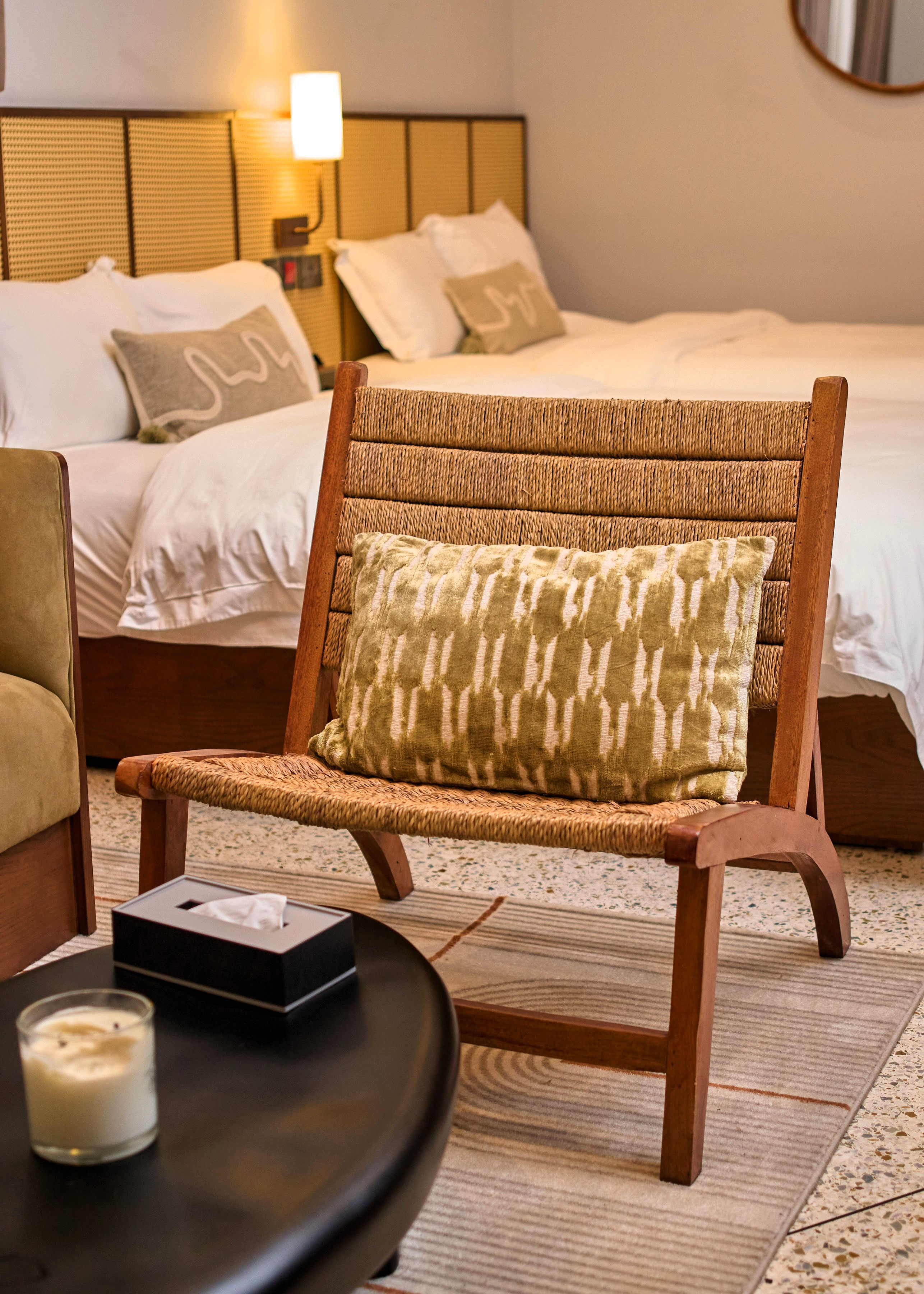 Close up of chair with bed in background