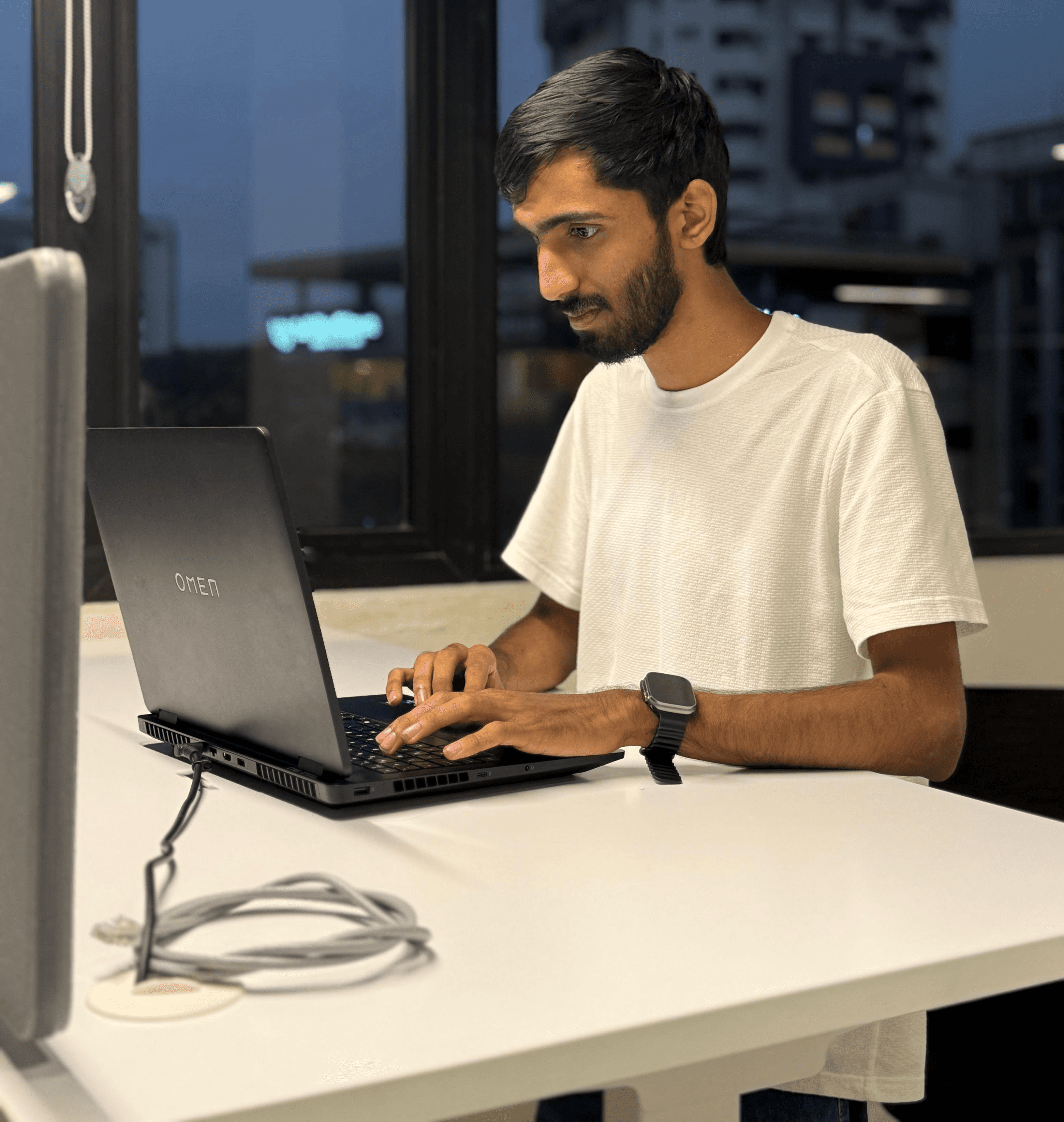 woman standing by wall holding mug