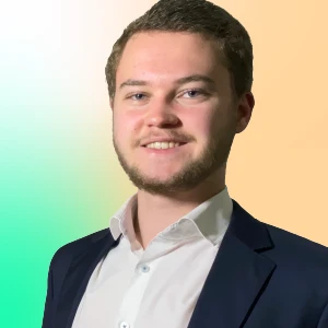 a woman in a black suit and sunglasses