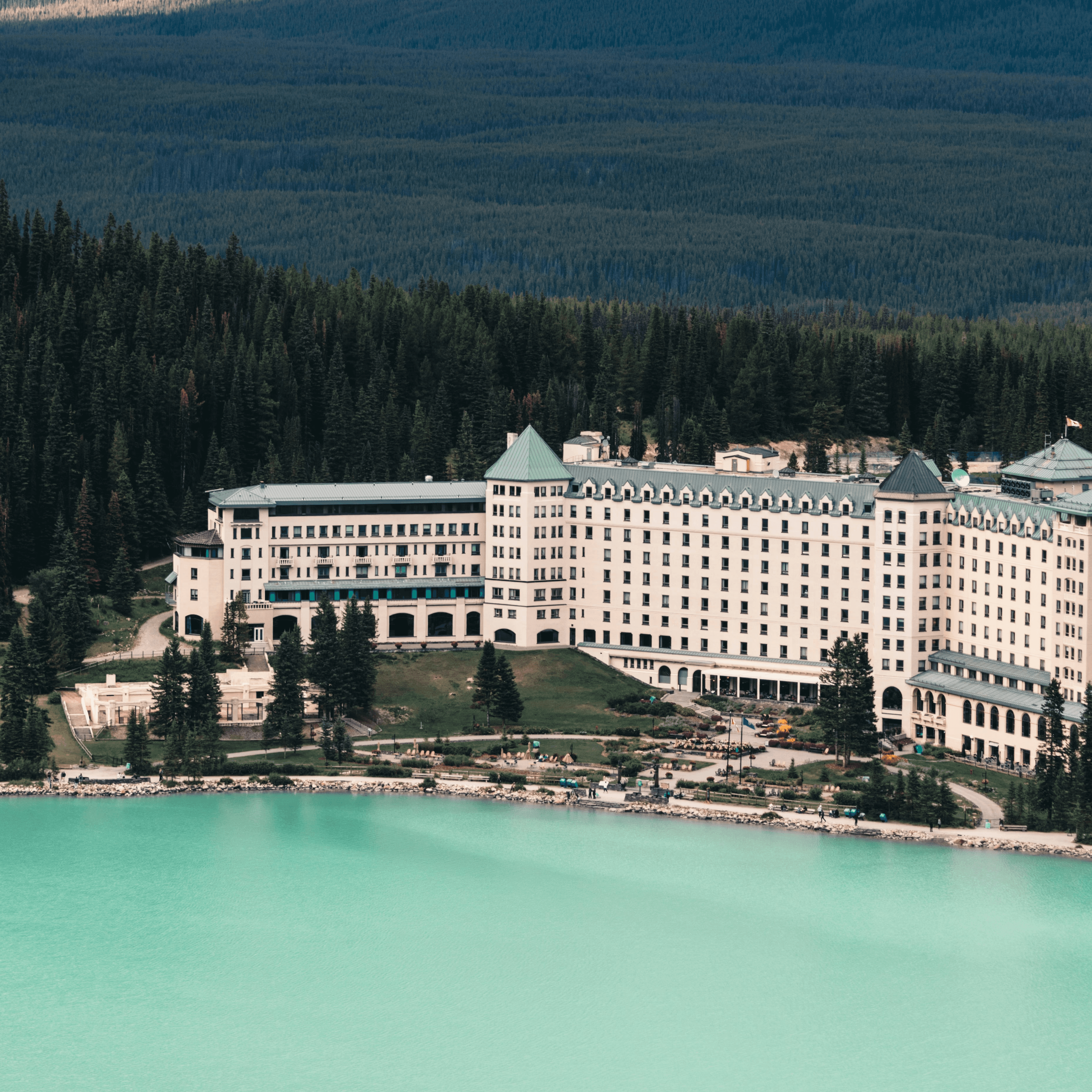 white concrete building near body of water during daytime. Credit: Ali Kazal