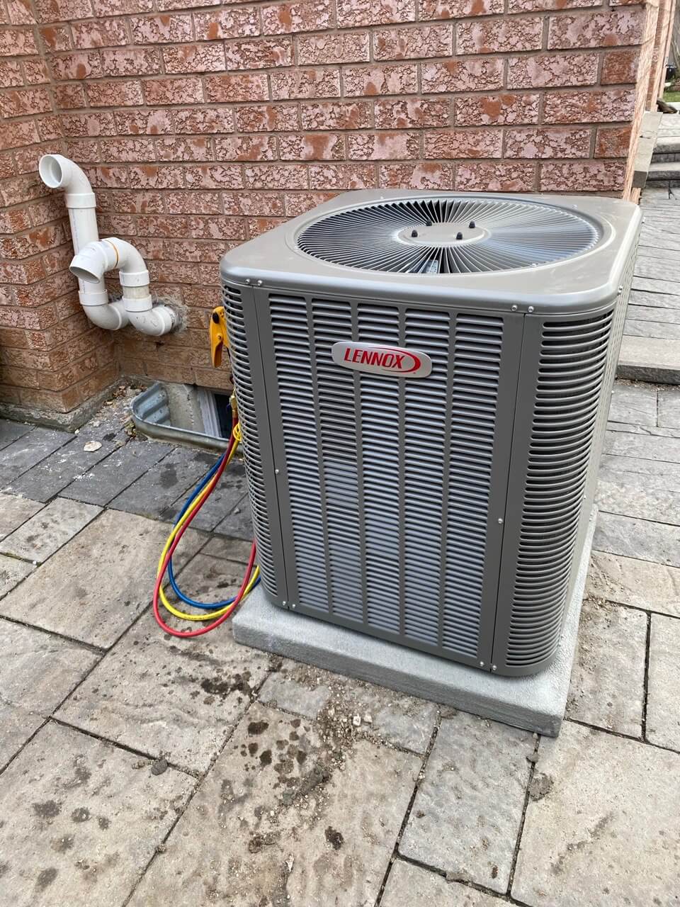 Air conditioner installed in a backyard in Toronto