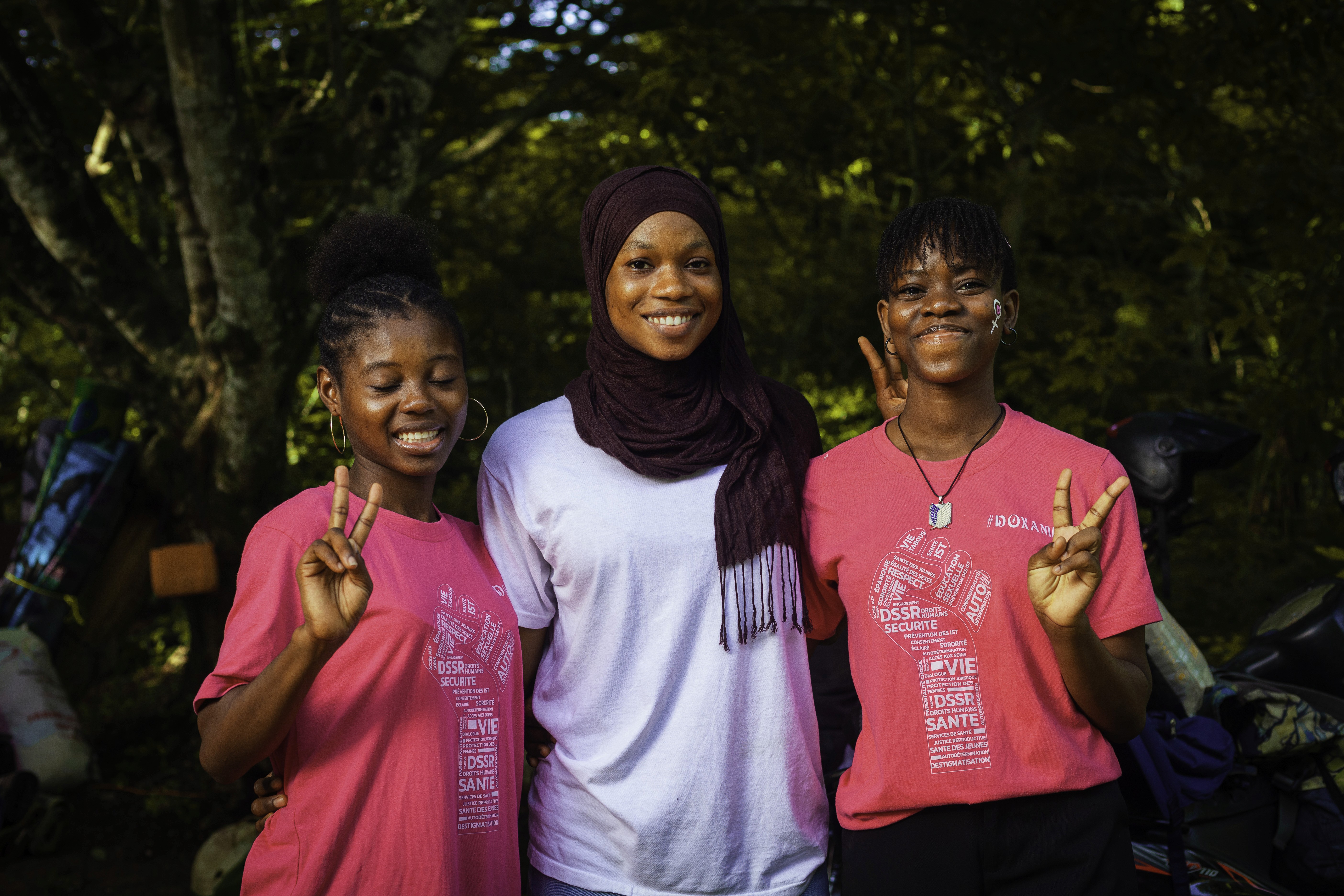 a group of women standing next to each other