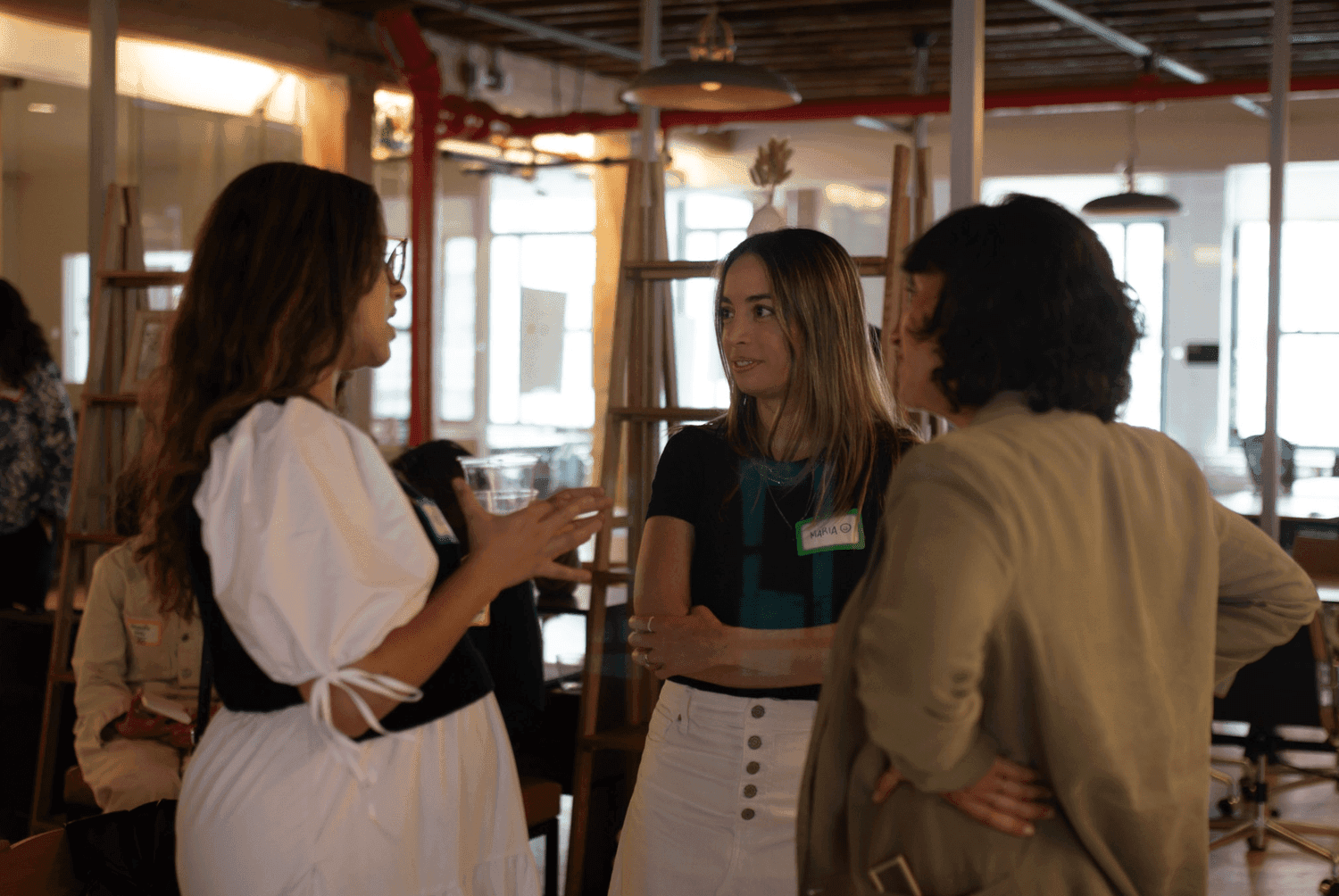 Three women talking to each other