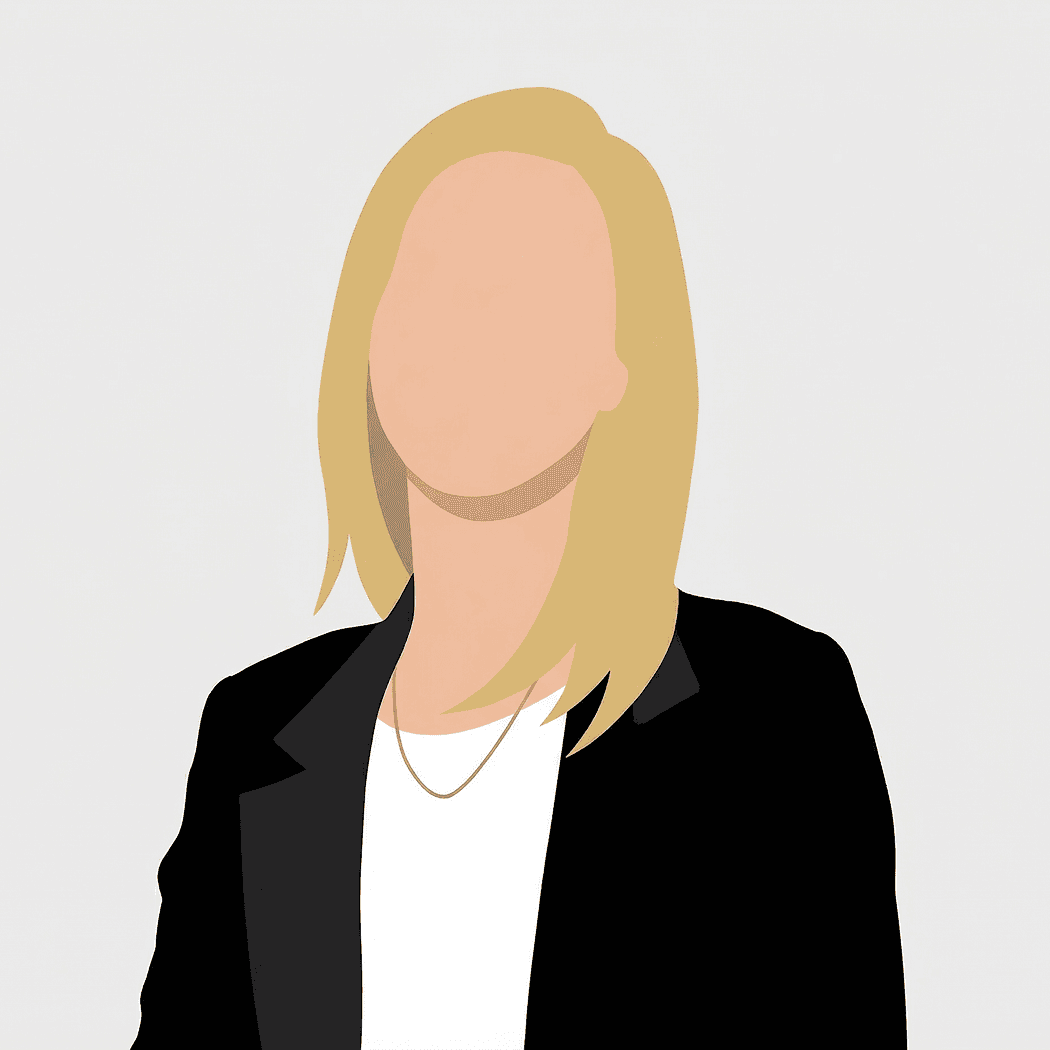 Amy standing by a window in an office